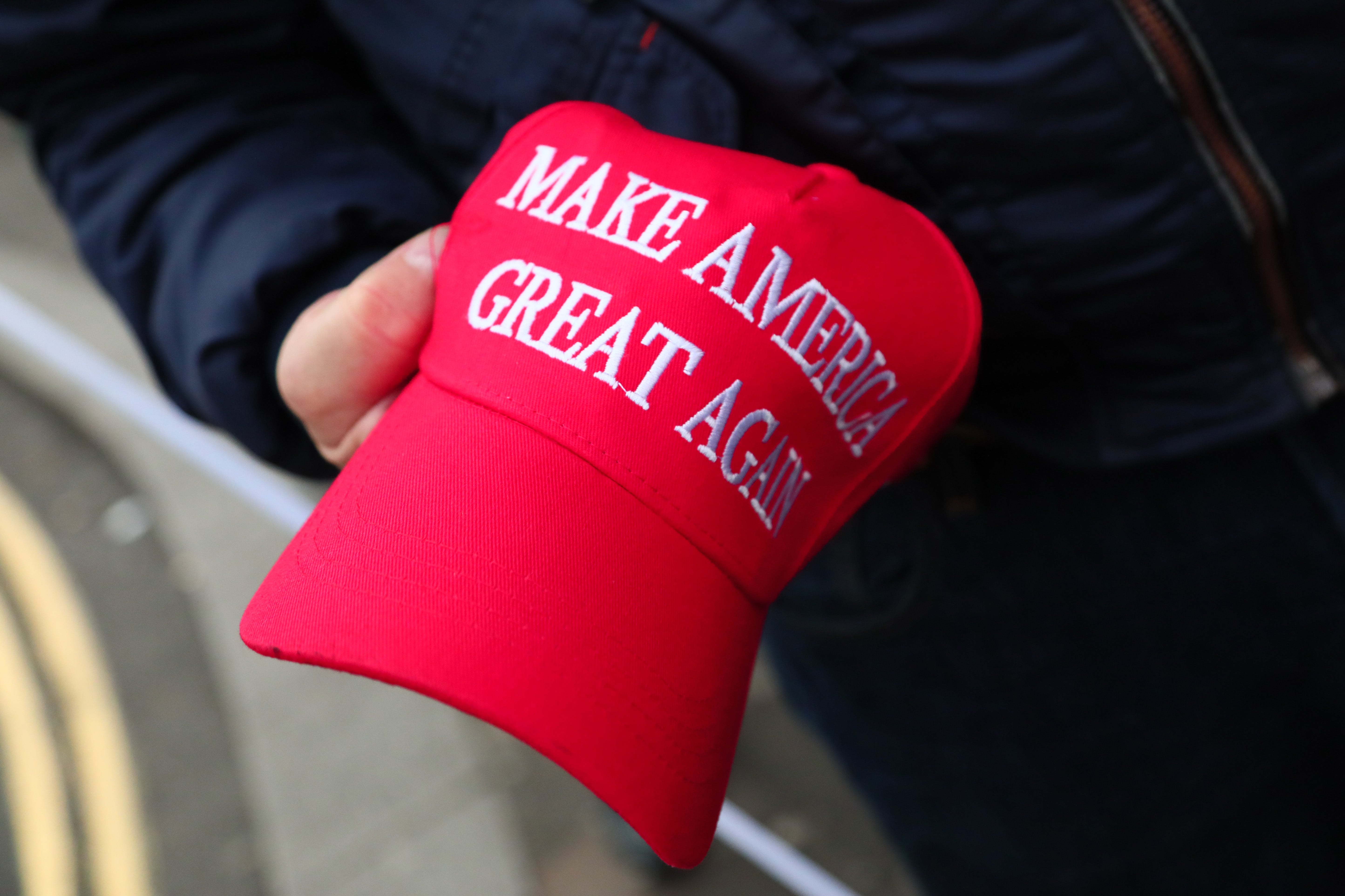 The hats have become a distinctive symbol of Trump’s campaign and allies