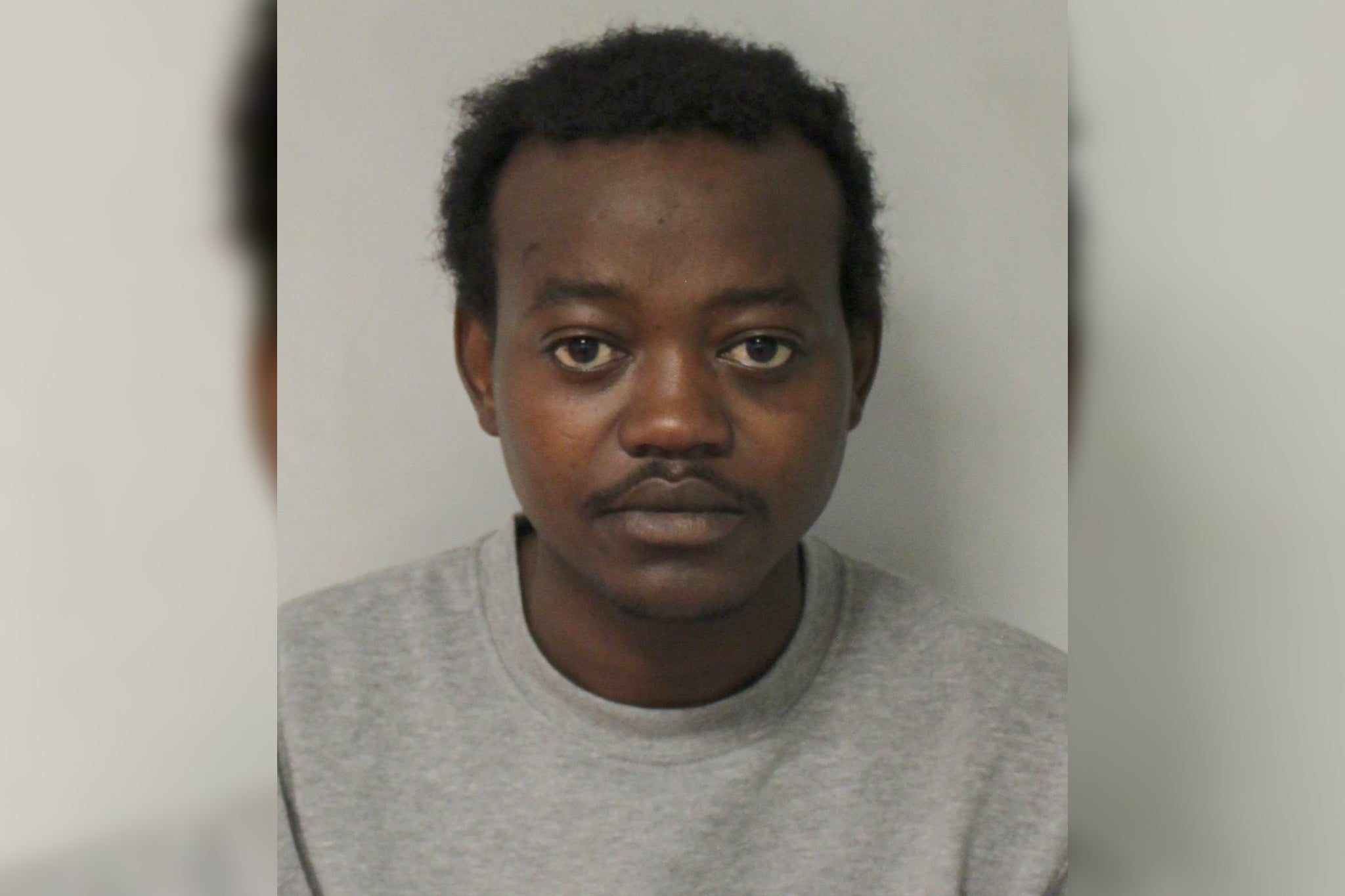 Rasheed Rahman after his arrest for murder (Metropolitan Police)