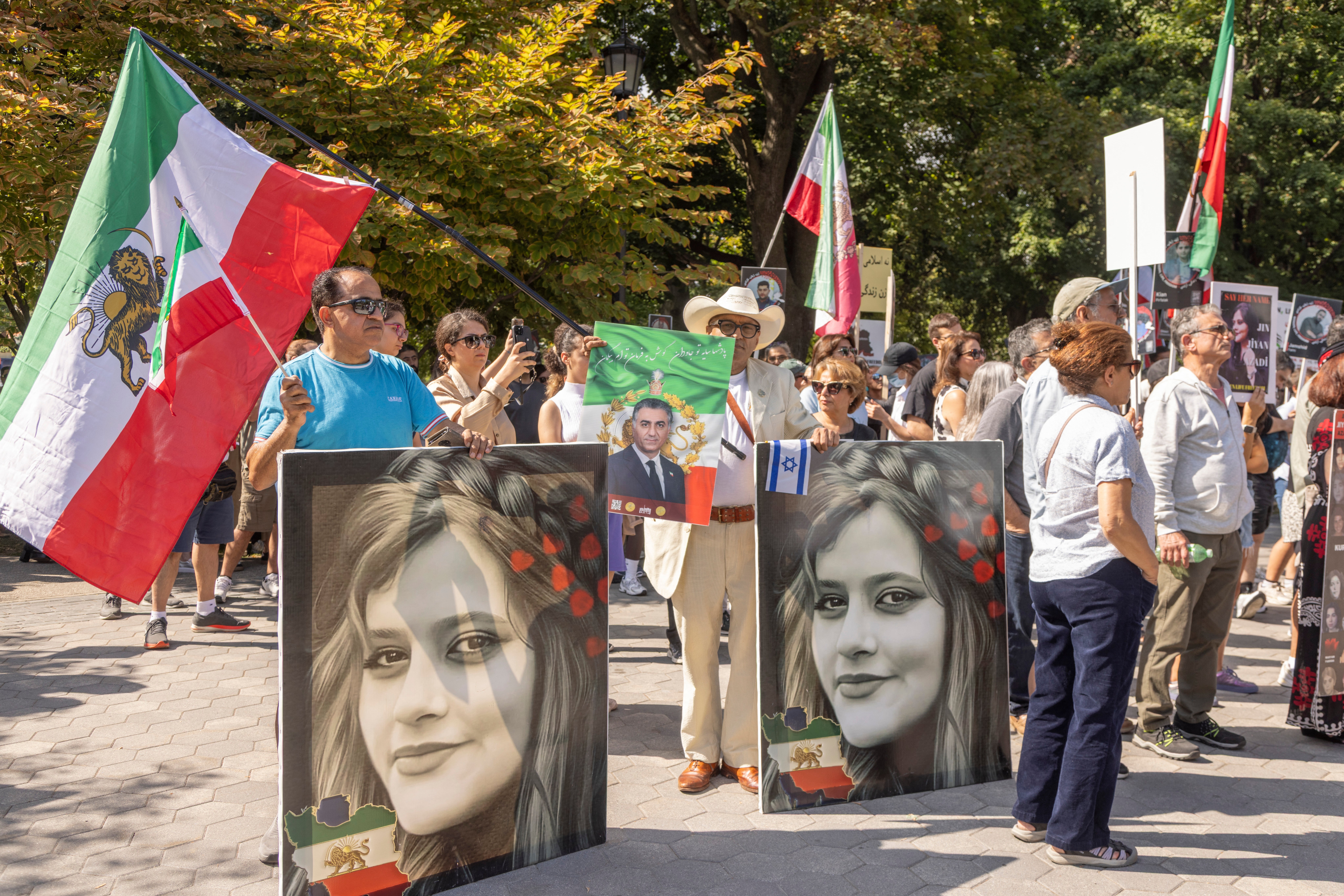 Supporters participate in a protest marking the third anniversary of Mahsa Jina Amini's death in memory of the Iranian victims of the Women, Life, Freedom movement at Queen's Park in Toronto