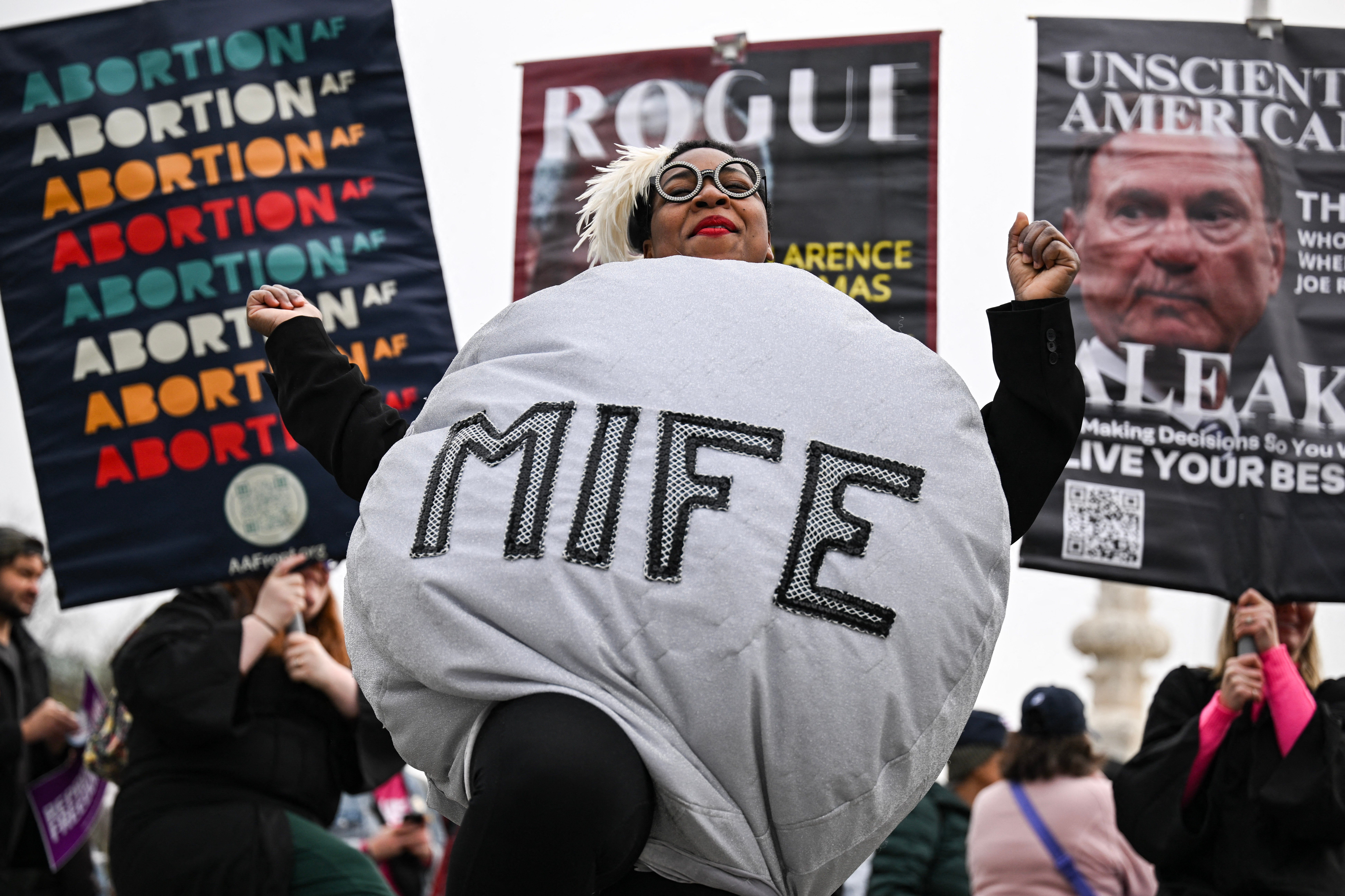 A woman dressed as a mifepristone pill dances with pro-choice activists during a rally outside the Washington, D.C., U.S. Supreme Court in April 2025. The Trump administration is reportedly launching a study of the pill’s safety — despite decades of research showing it is