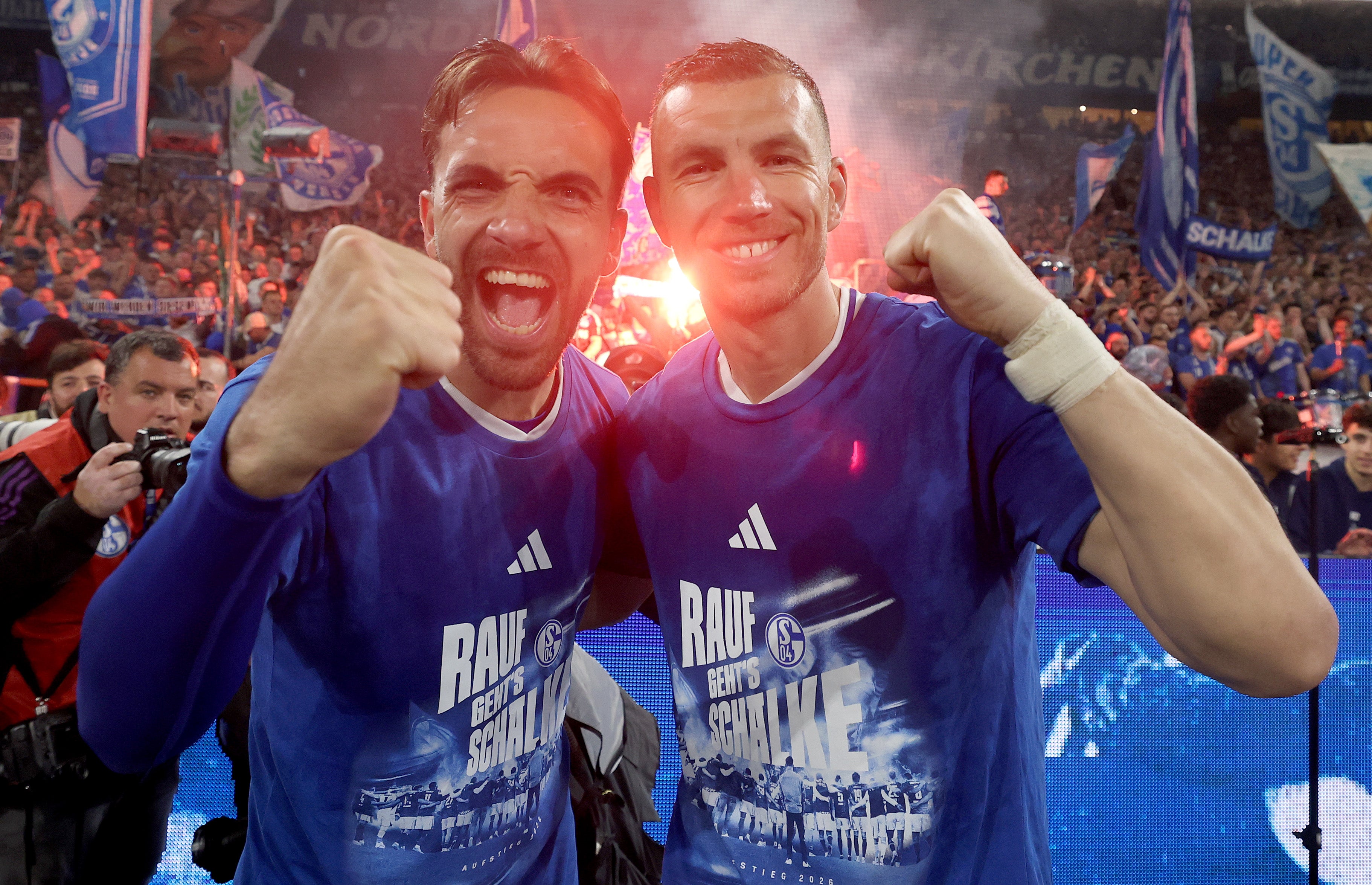 Edin Dzeko and Kenan Karaman of FC Schalke 04 celebrate promotion to the Bundesliga (Getty)