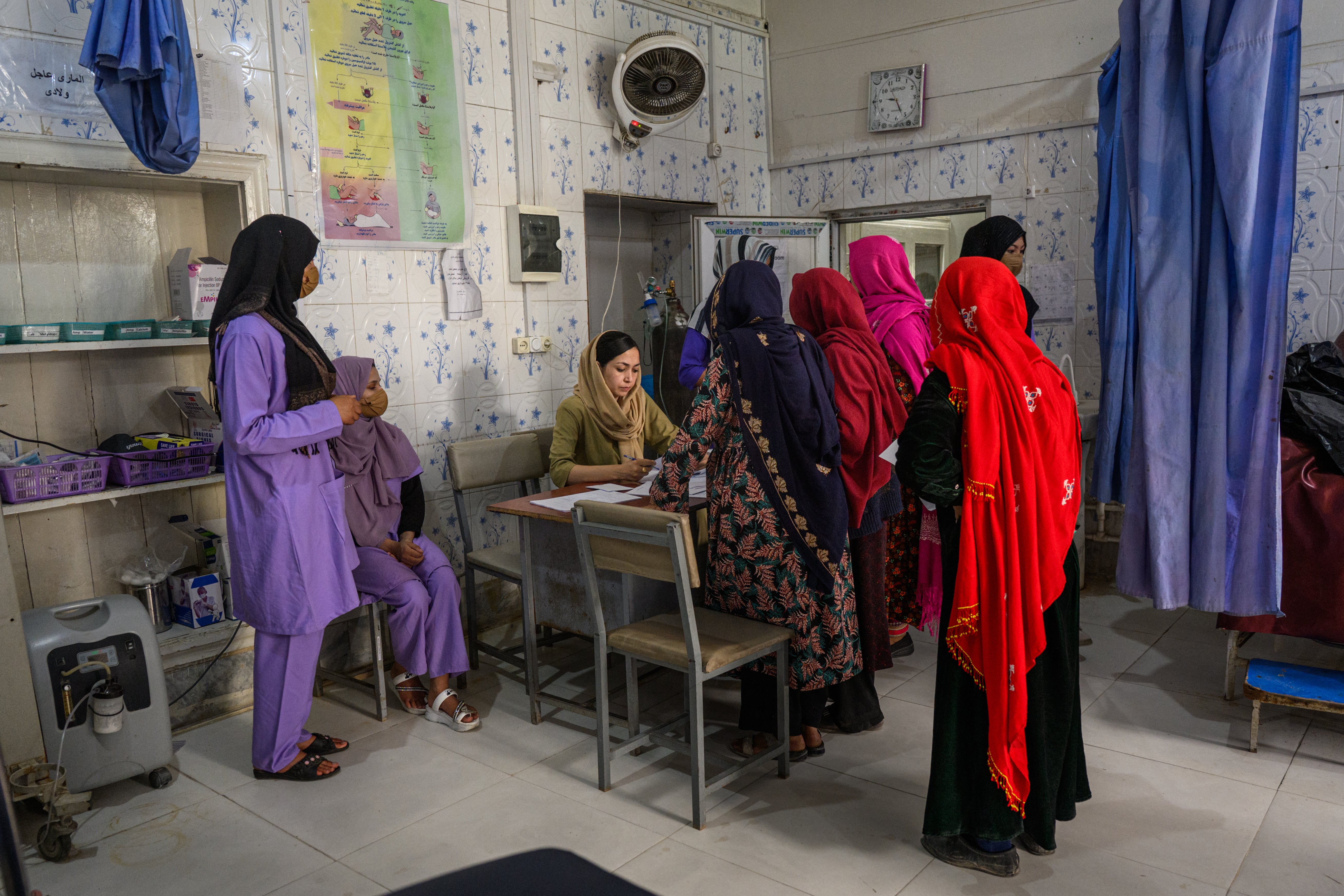Surgeon Bibi Khadija Sadat, 35, registers patients at the provincial hospital's maternity unit n Ghazni, Afghanistan