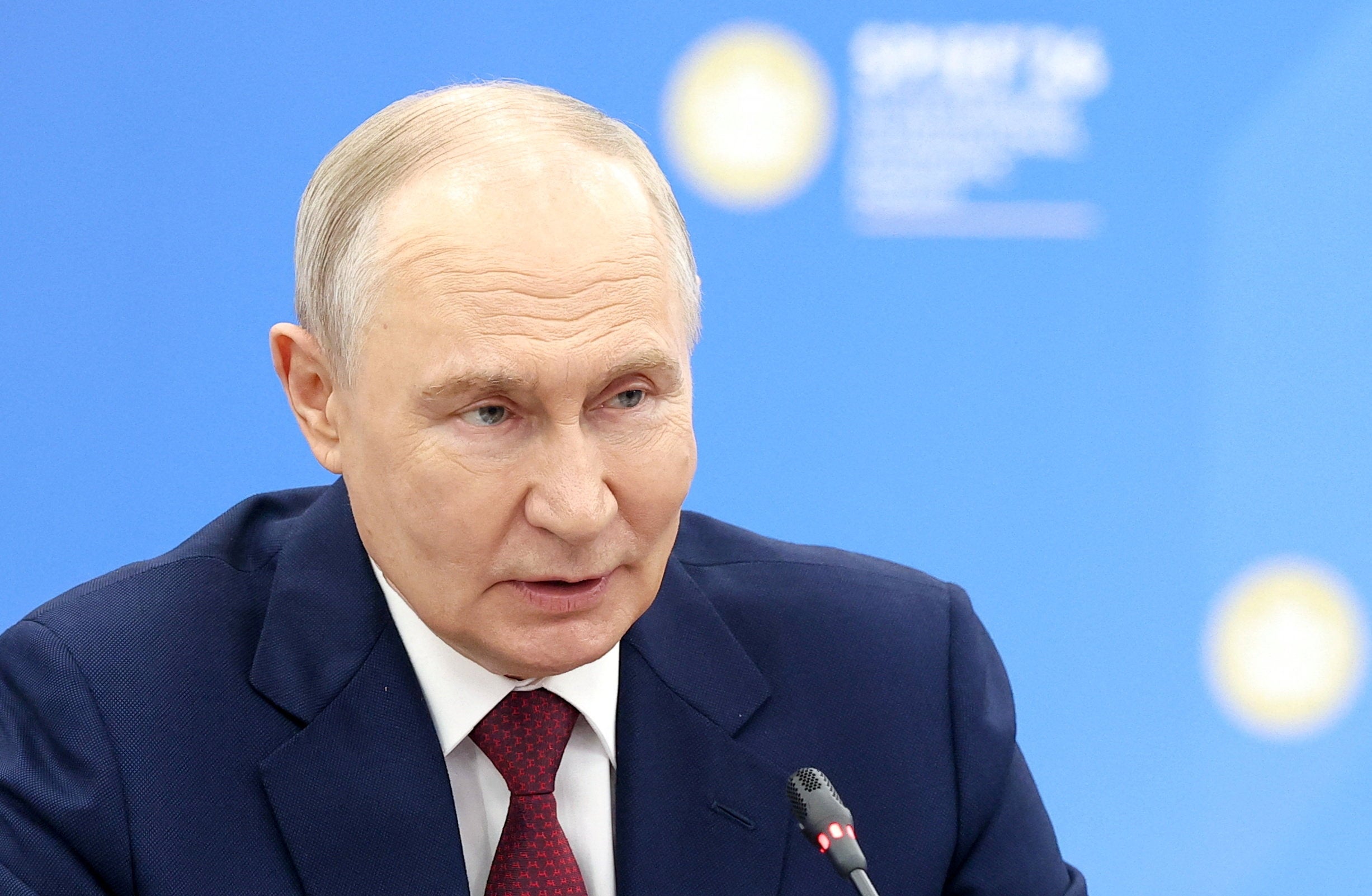 Russian president Vladimir Putin attends a meeting with Chinese vice president Han Zheng on the sidelines of the St. Petersburg International Economic Forum (Reuters)