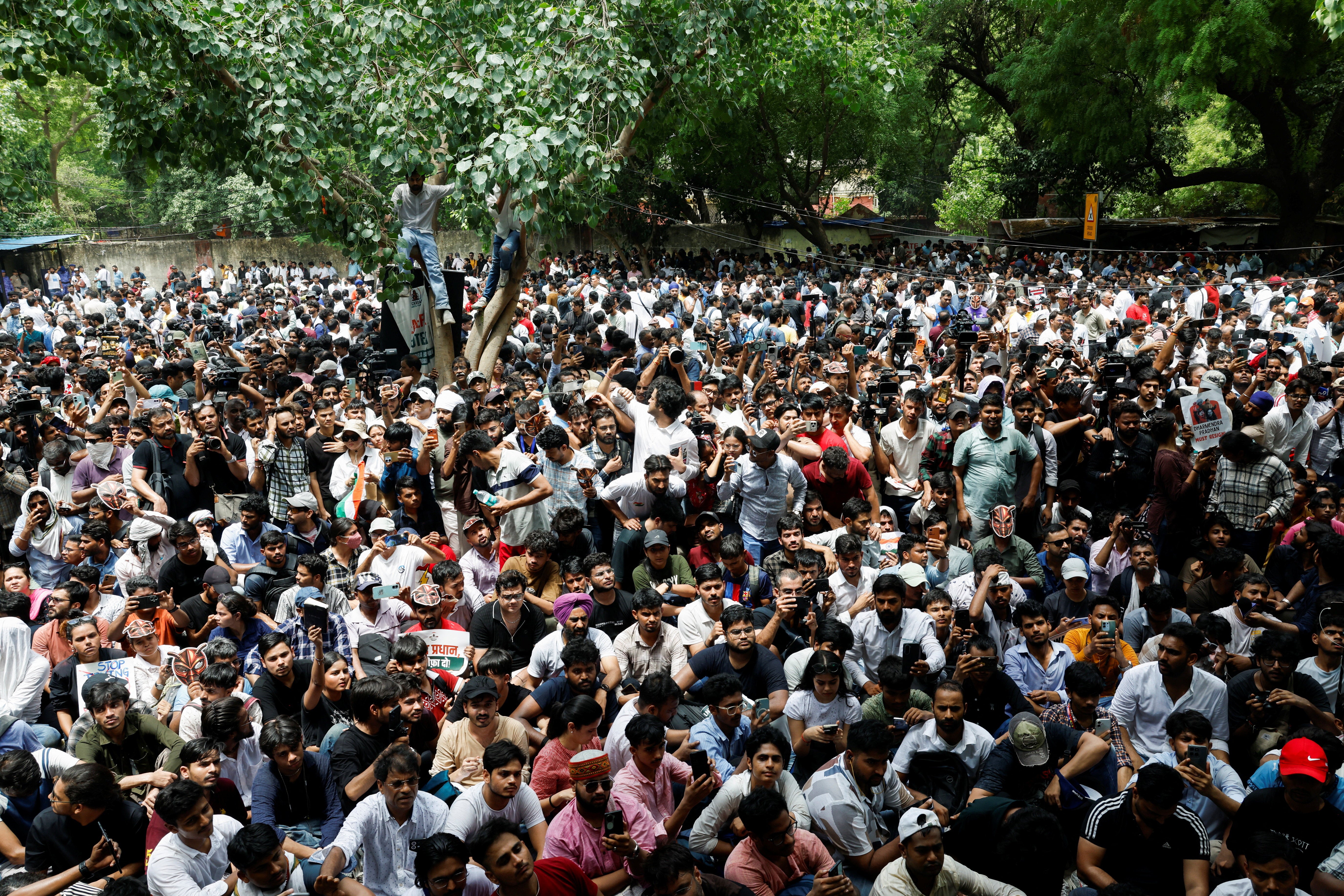Supporters of the Cockroach Janta Party (CJP) gather during a sit-in protest demanding the resignation of Indian Education Minister Dharmendra Pradhan