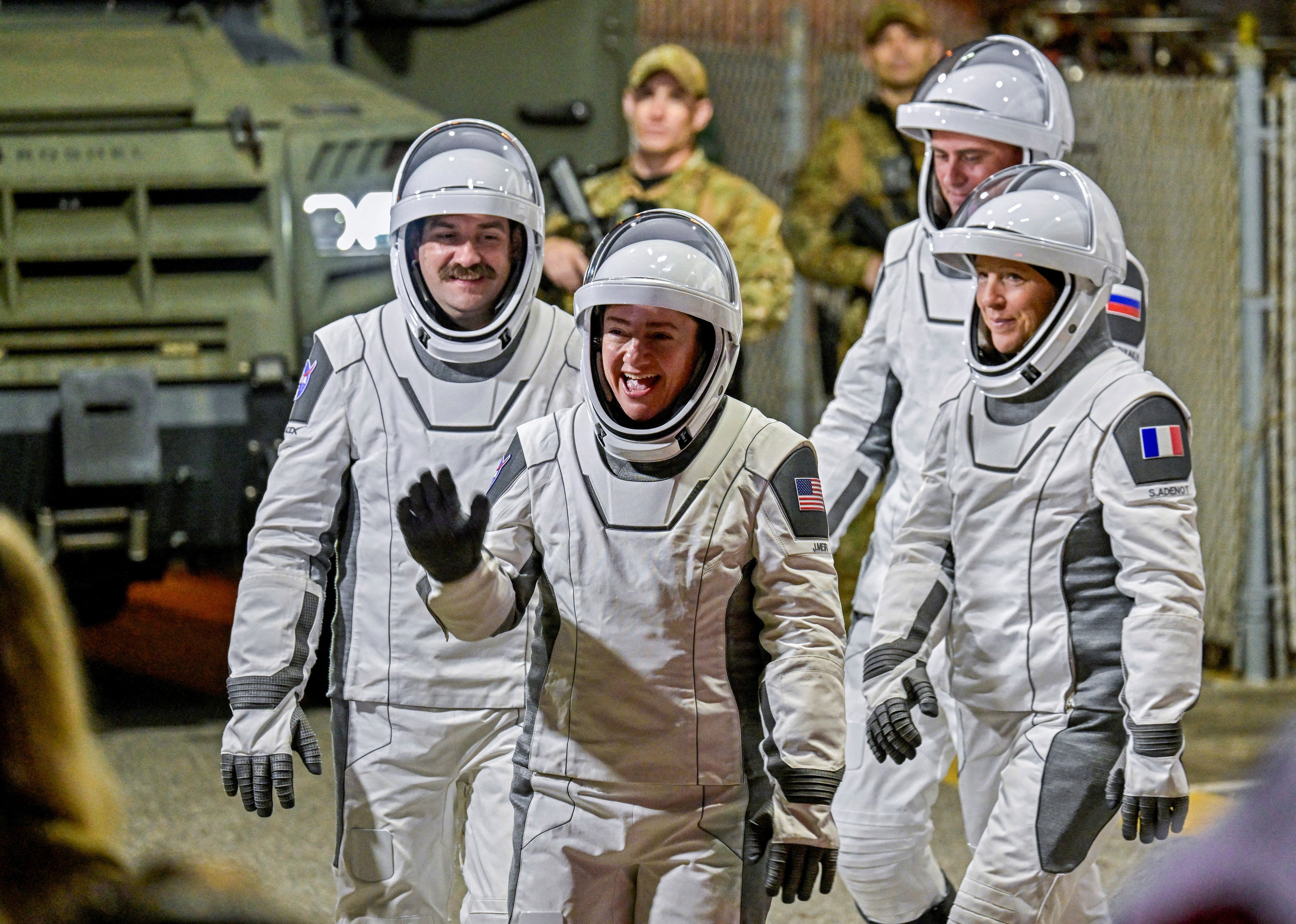 Crew-12 members, Russian cosmonaut Andrey Fedyaev, NASA astronauts Jack Hathaway, Jessica Meir, and ESA astronaut Sophie Adenot walk out of the Operations & Checkout Building at the Kennedy Space Center before transport to Launch Complex 40, ahead of their launch to the International Space Station