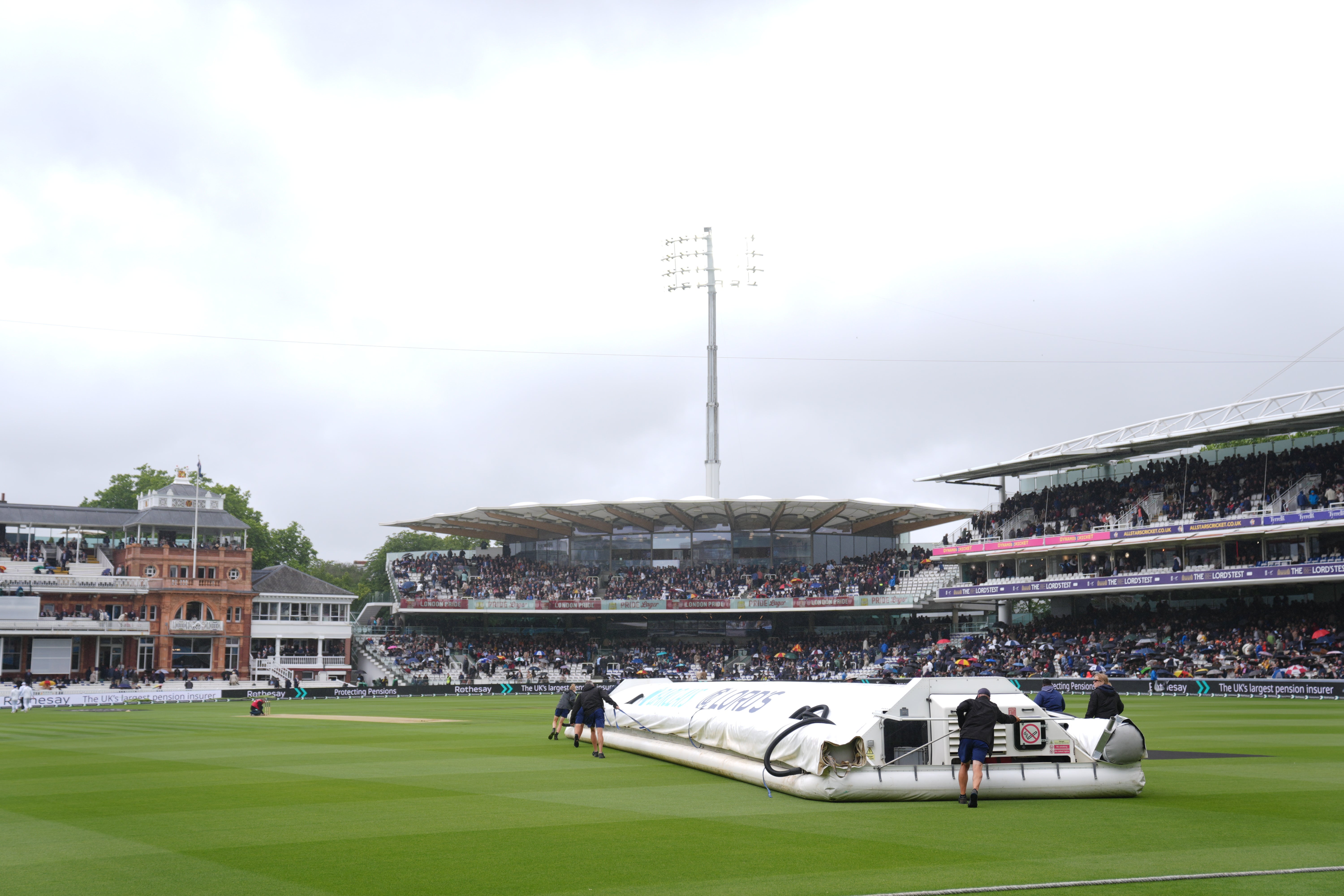 Ground staff put rain covers on the pitch for a second time on day three at Lord’s (Ben Whitley/PA). (PA Wire)