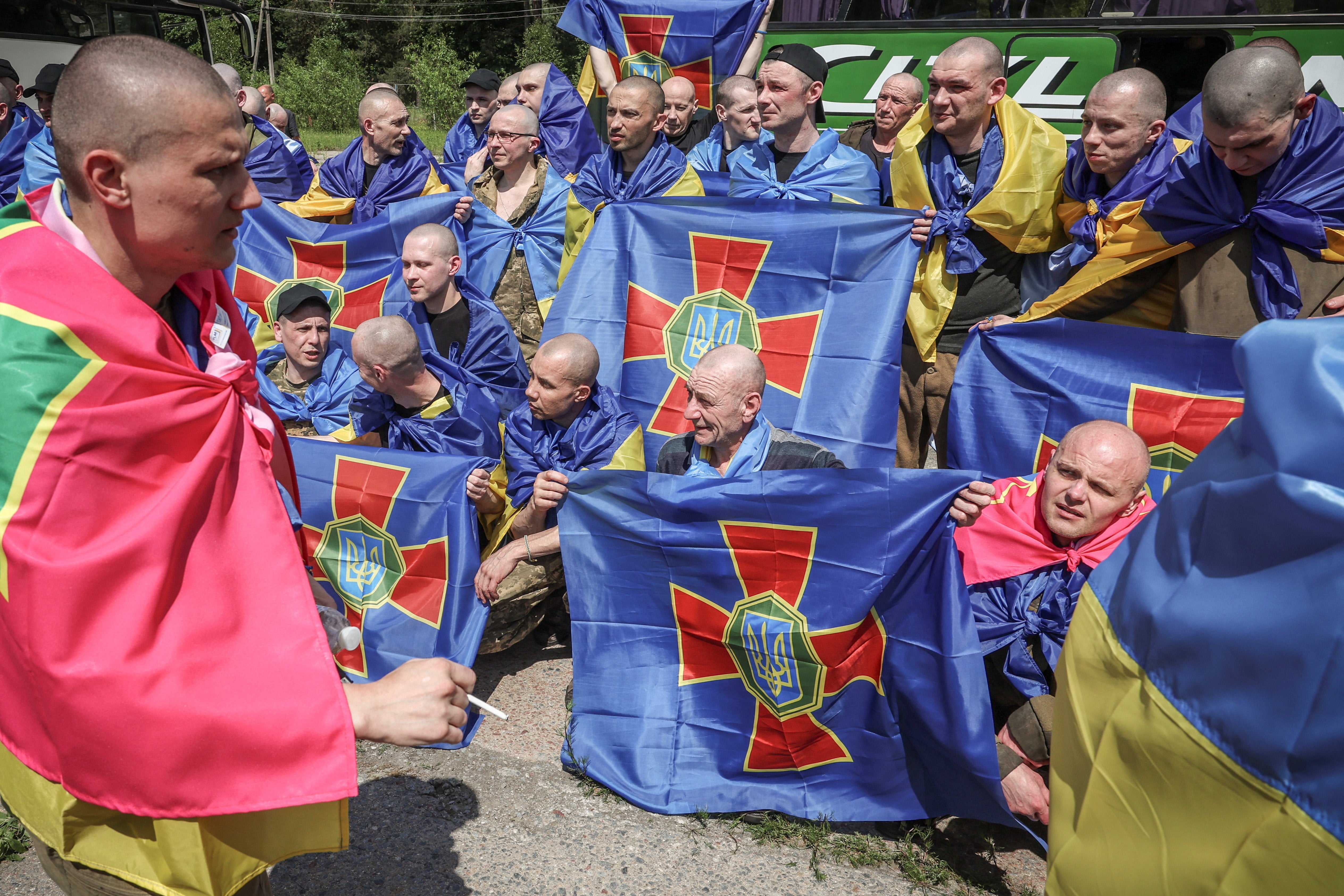 Ukrainian prisoners of war gather after a swap at an undisclosed location in Ukraine, June 5, (Reuters)
