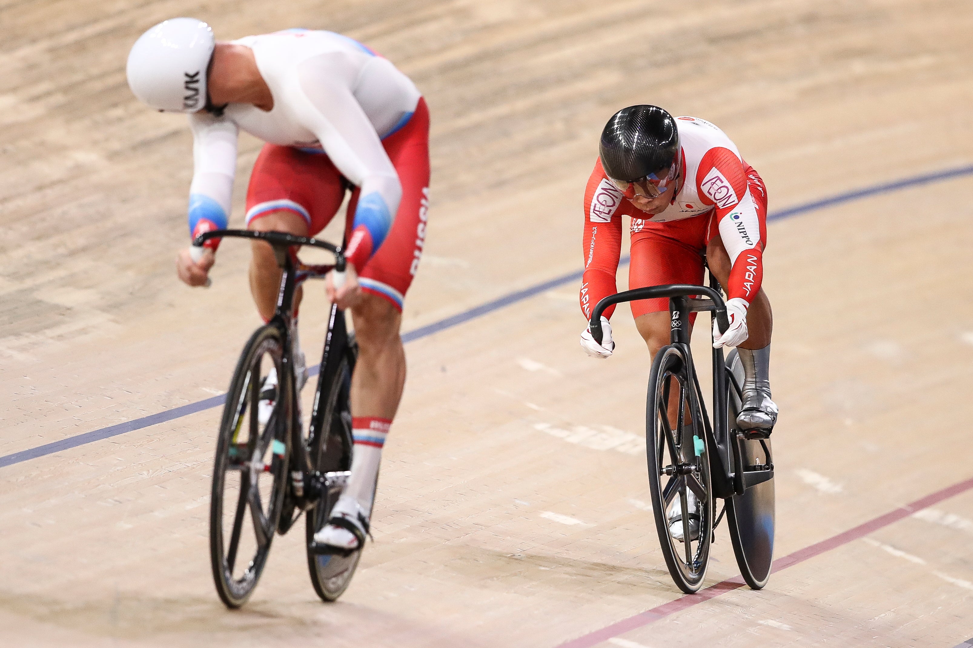 Russian player compete with a Japanese player during UCI Track Cycling World Championships in Berlin