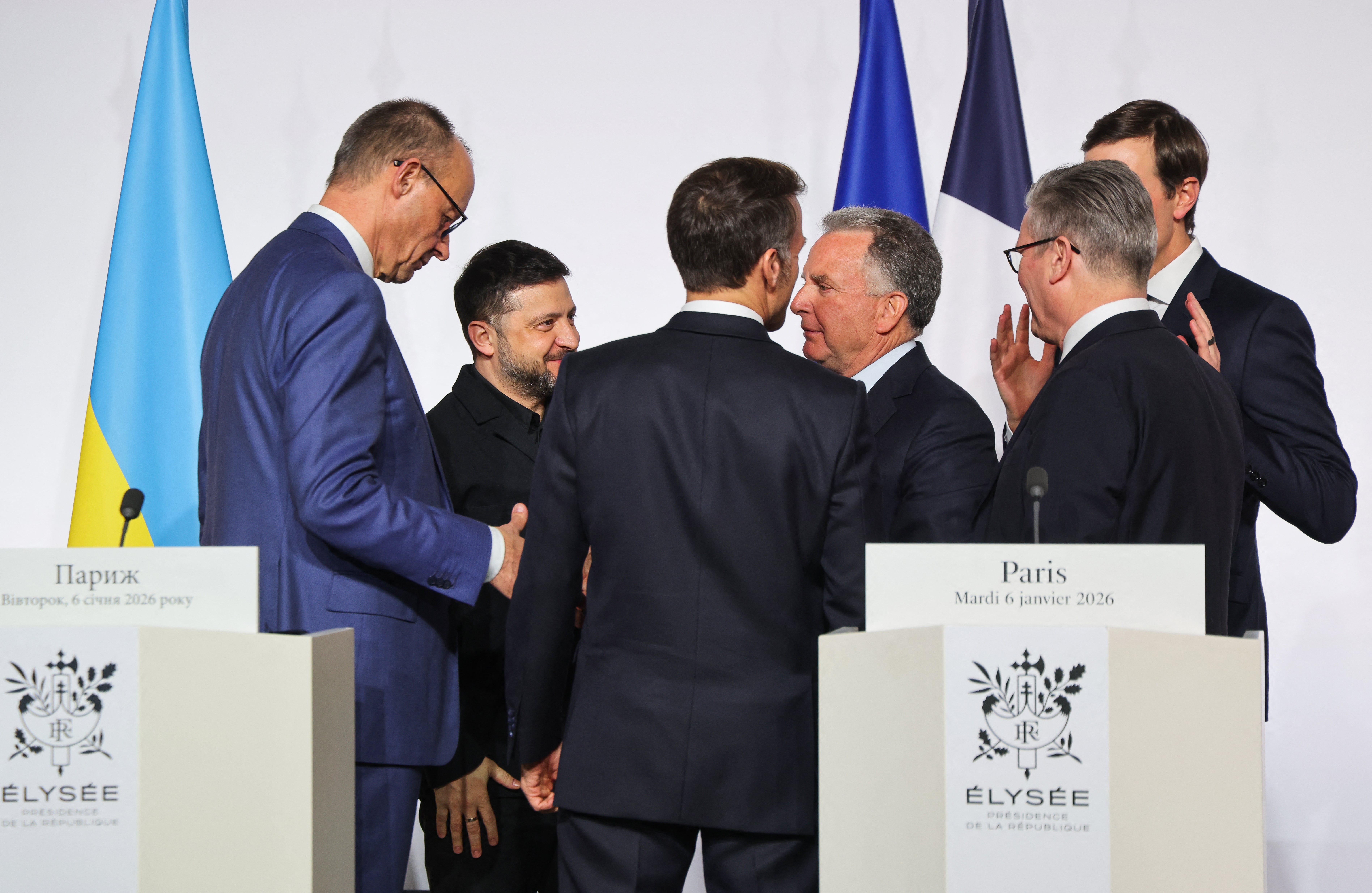 Germany's chancellor Friedrich Merz, Ukraine's president Volodymyr Zelensky, France's president Emmanuel Macron, US Special Envoy Steve Witkoff, Britain's prime minister Keir Starmer and US businessman Jared Kushner speak after a press conference upon the signing of the declaration on deploying post-ceasefire force in Ukraine