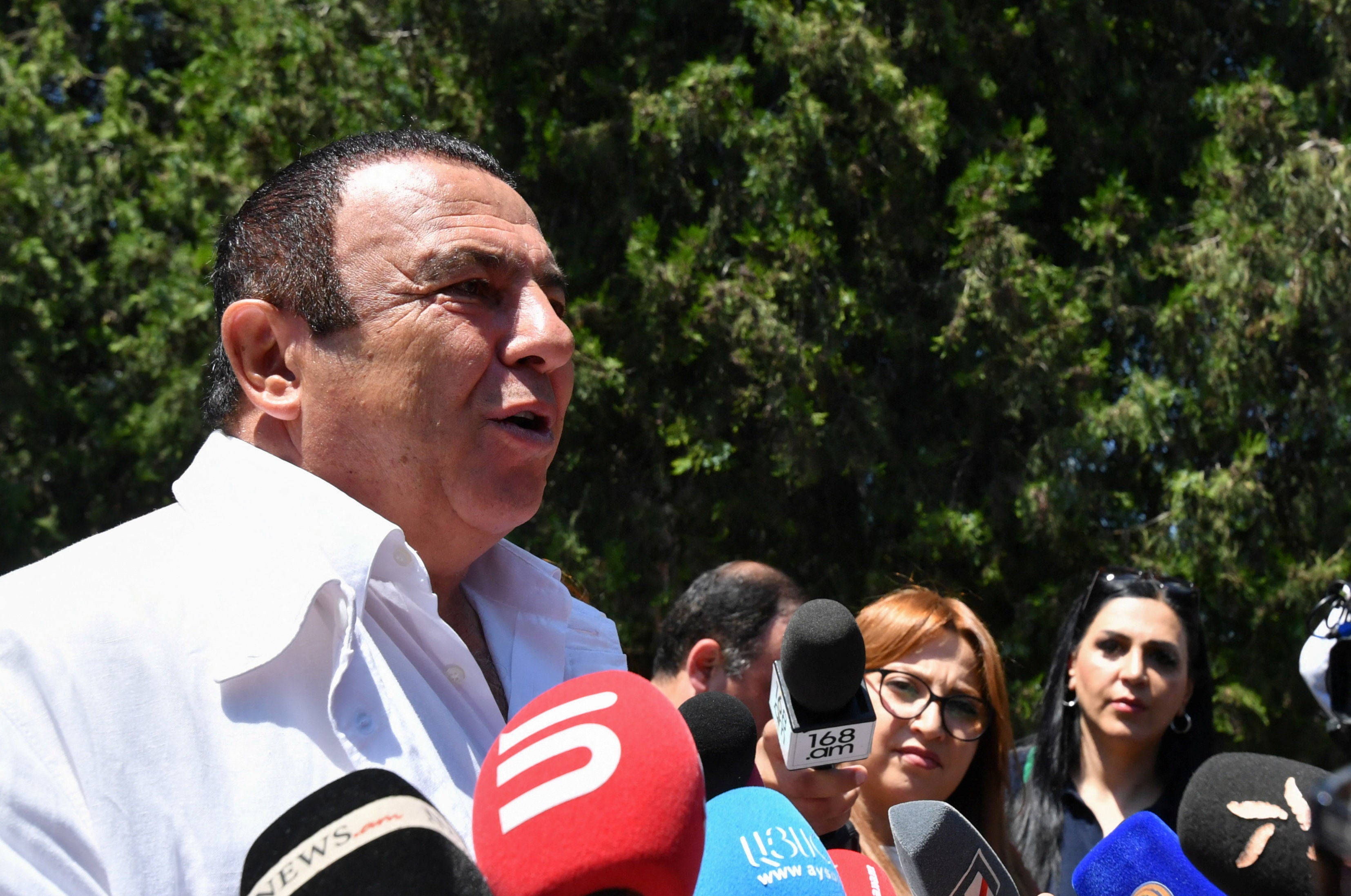 Leader of the Prosperous Armenia party Gagik Tsarukyan speaks with journalists near a polling station during a parliamentary election in the village of Arinj outside Yerevan, Armenia, June 7, 2026 (Reuters)