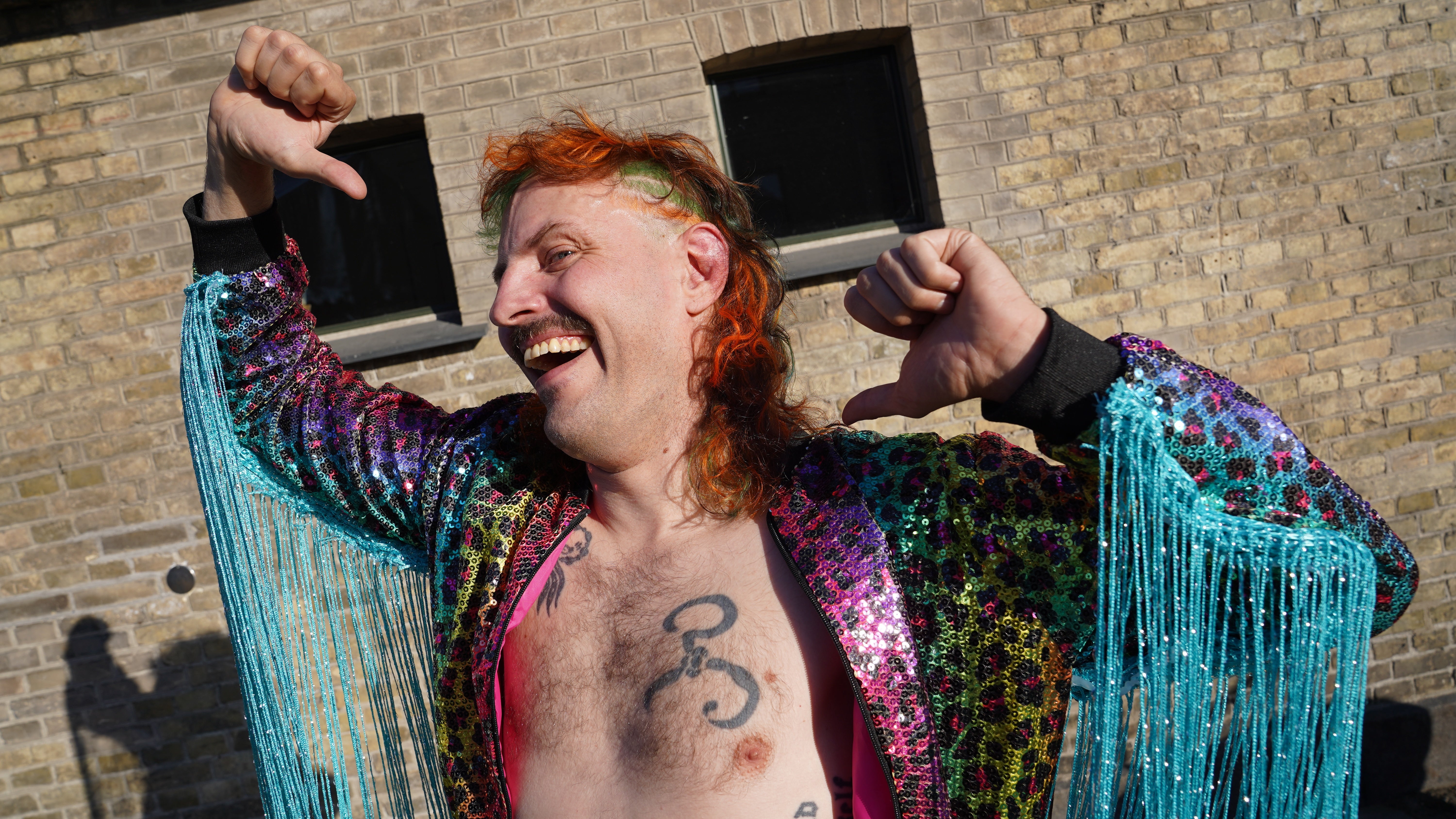Competitor Martin Sedolf performs as character pro wrestler 'Benny Bacchus', at Denmark's Mullet Championship in central Copenhagen, Saturday, June 6, 2026. (AP Photo/James Brooks) (AP)