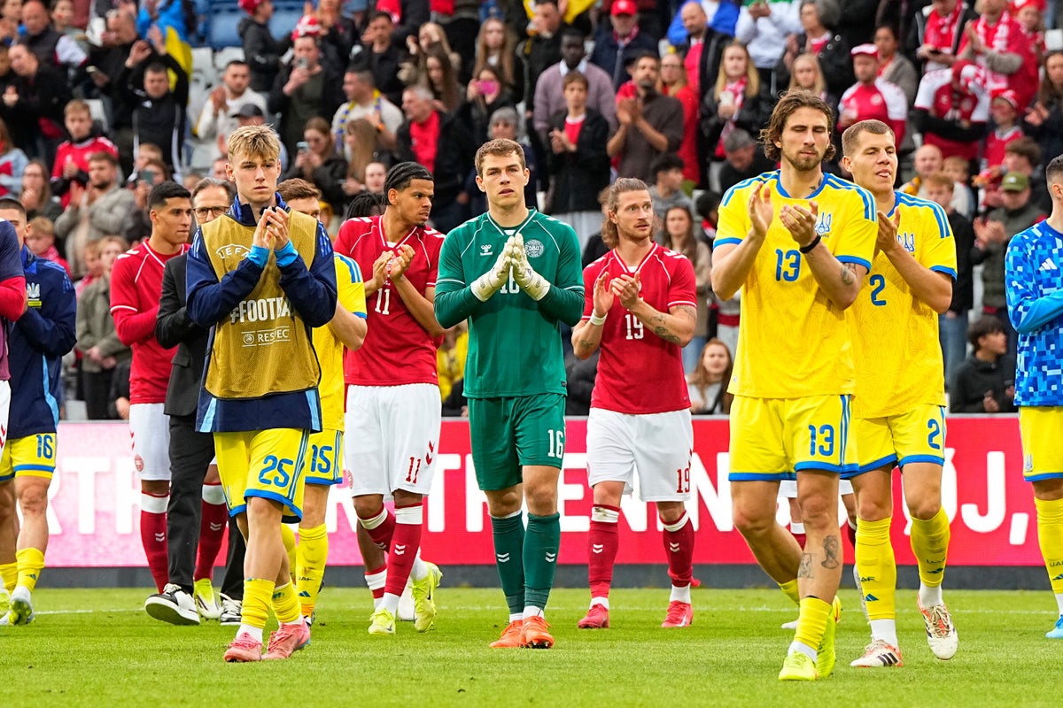 Denmark says soccer star Christian Eriksen 'conscious' after