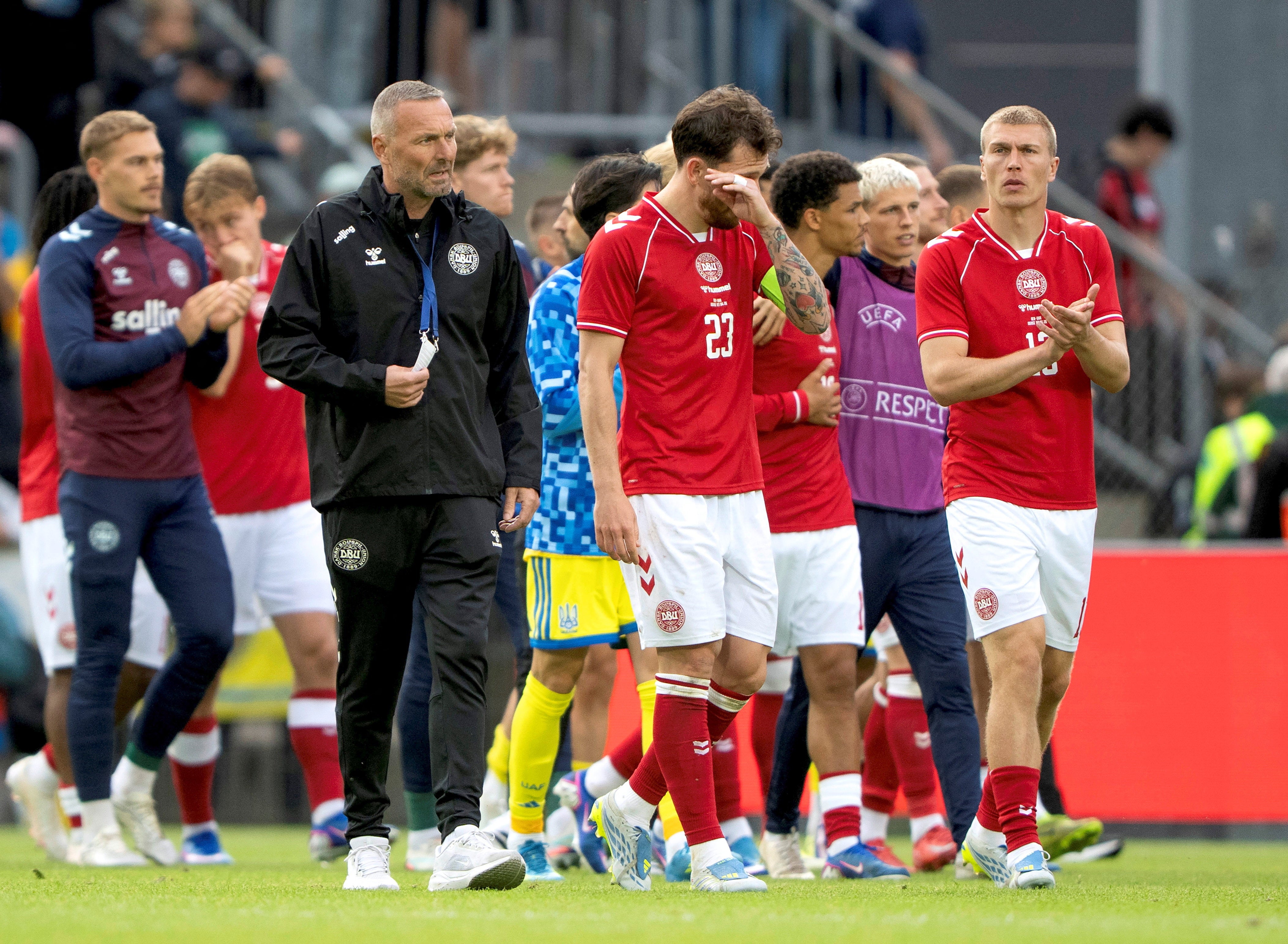 Denmark players and staff react after Christian Eriksen&rsquo;s collapse led to their match being abandoned