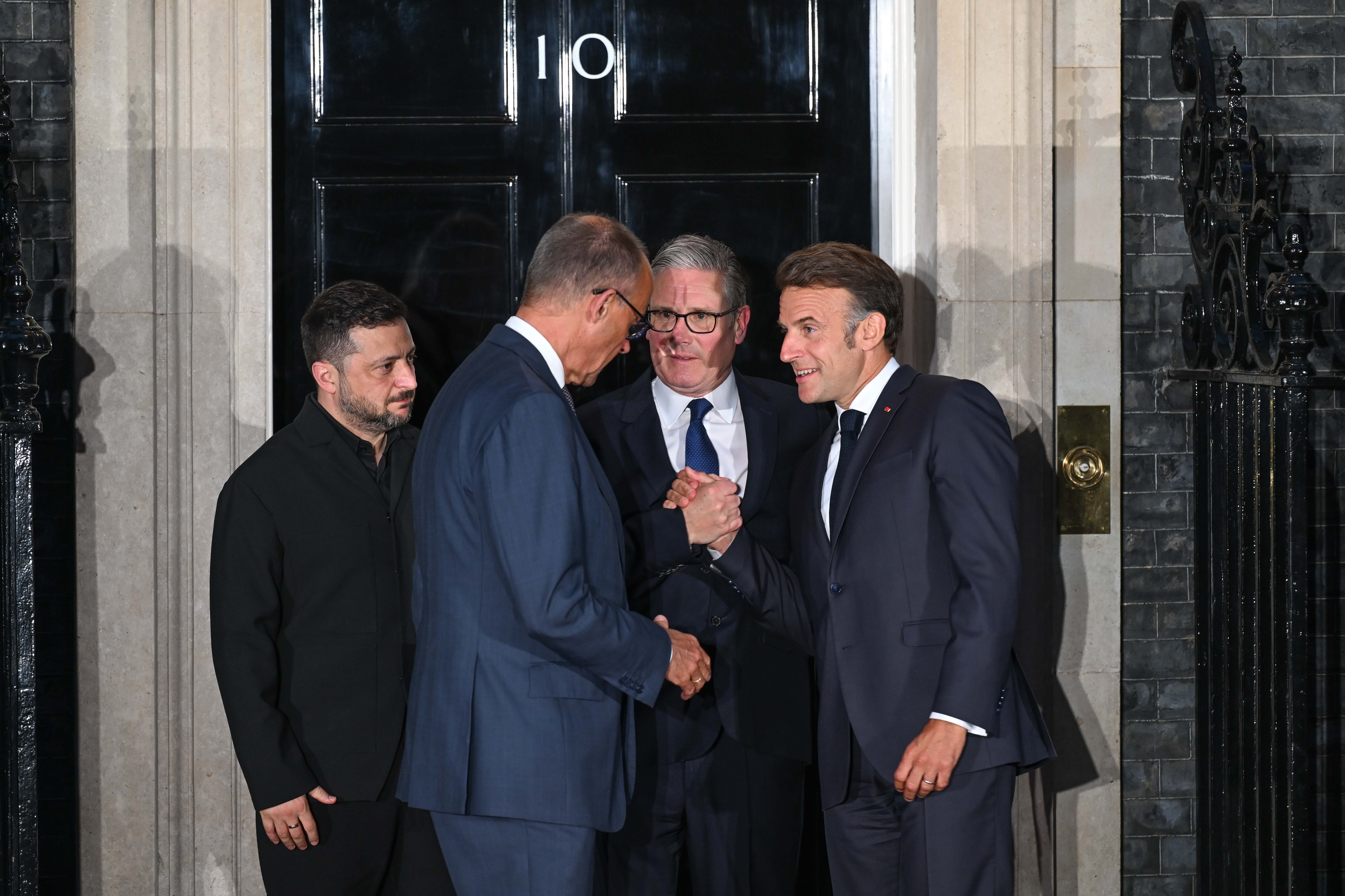 Merz (L) and Macron (R) with Zelensky (far left) and Starmer (C)