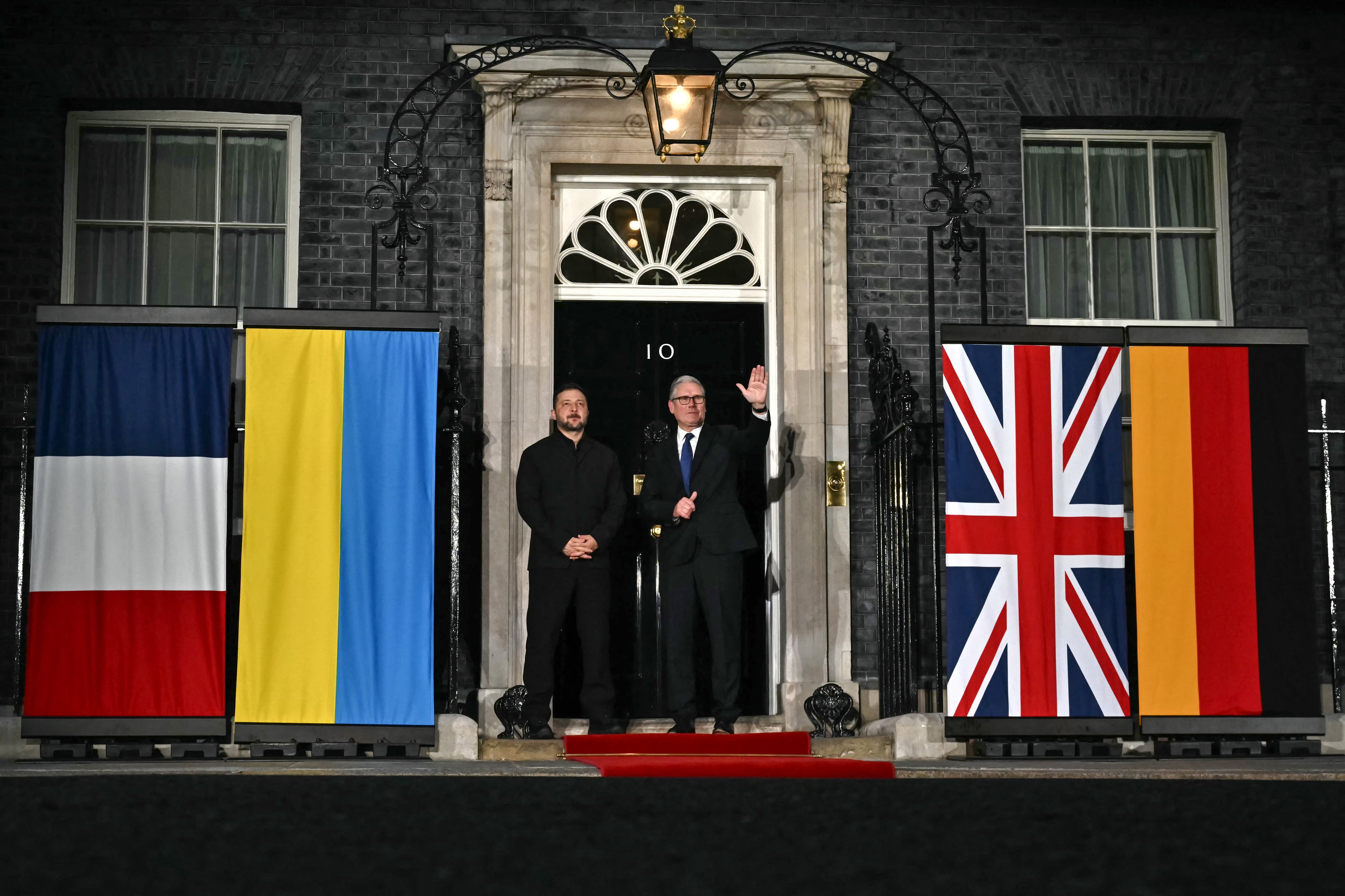 Ukraine's president Volodymyr Zelensky and prime minister Keir Starmer wave off Germany's chancellor Friedrich Merz and France's president Emmanuel Macron at 10 Downing Street after their meeting in central London