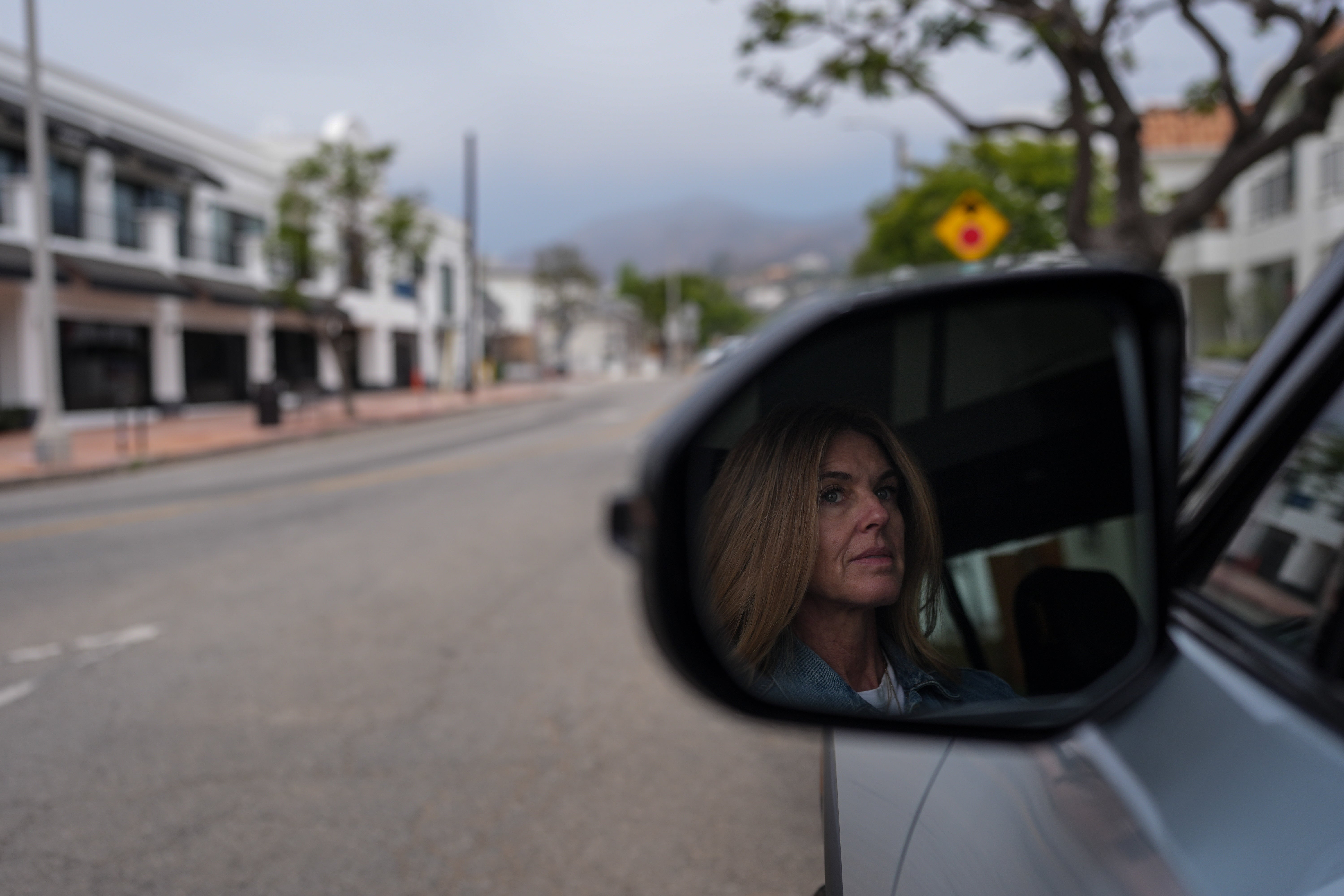 Meghan Wald poses for a photo in her car in the Pacific Palisades neighborhood of Los Angeles