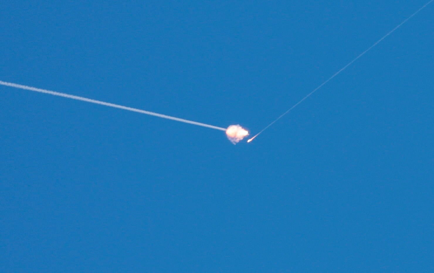 Israeli anti-air defence system interceptors engage with Iranian missile