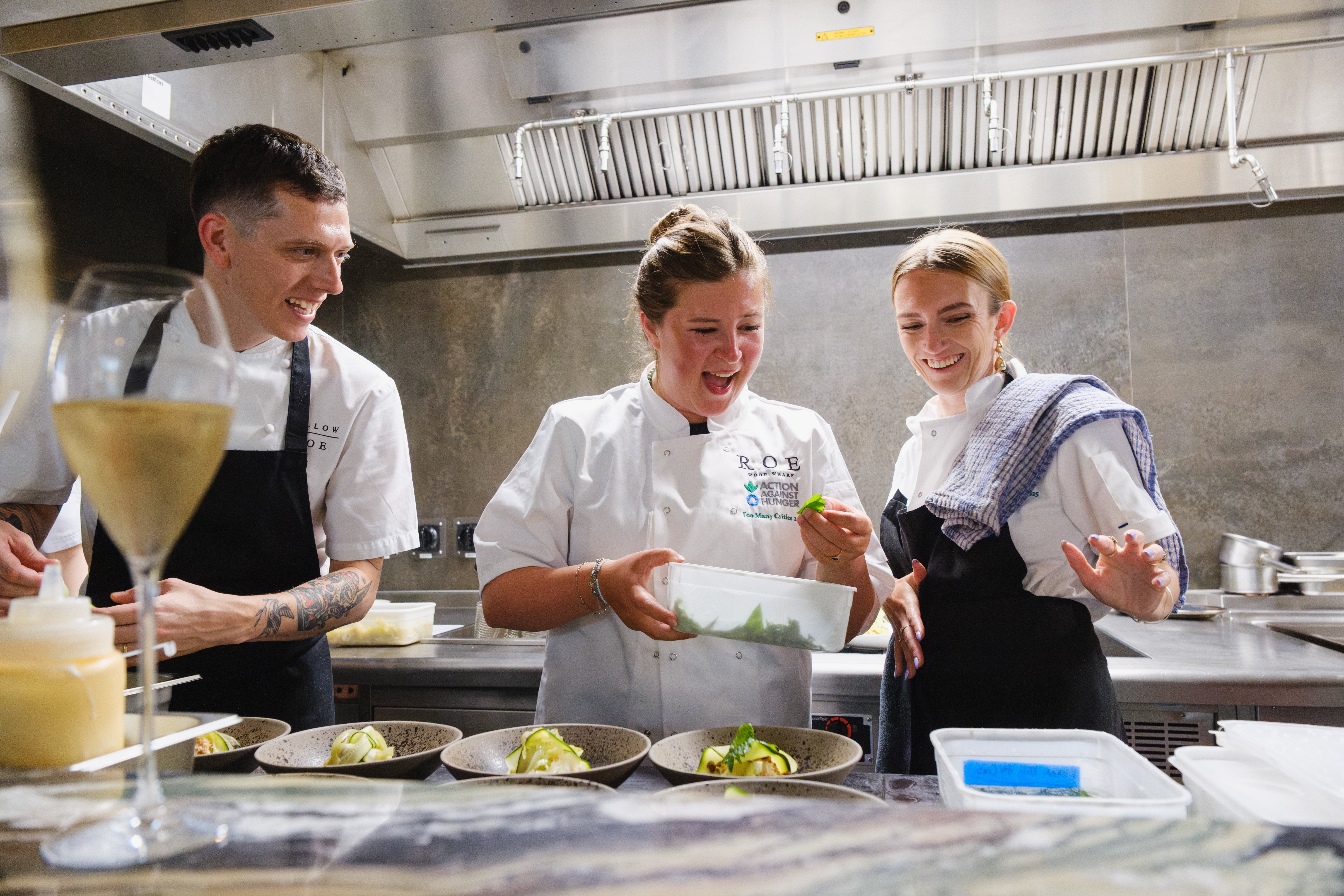 Molly Codyre (left) questions why my crab-salad assignment involved considerably less sweating than her afternoon at the grill