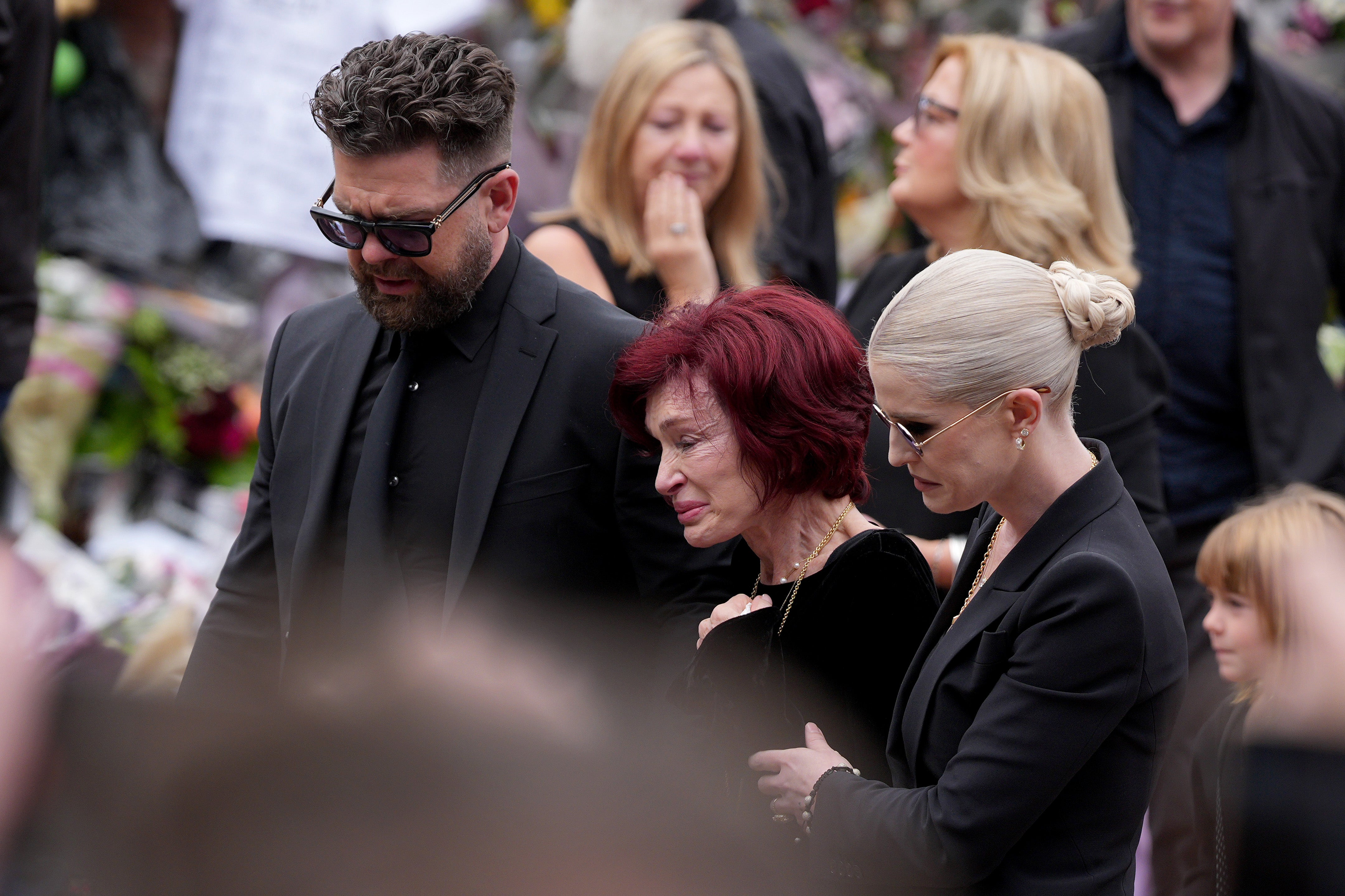 From L-R: Jack, Ozzy and Kelly Osbourne at Ozzy's funeral in July