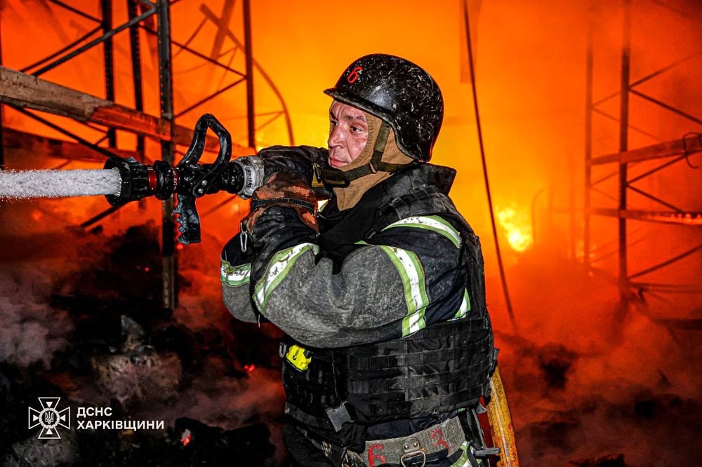 A rescue worker puts out a fire of a storage facility after a Russian strike in Kharkiv (Ukrainian Emergency Service)