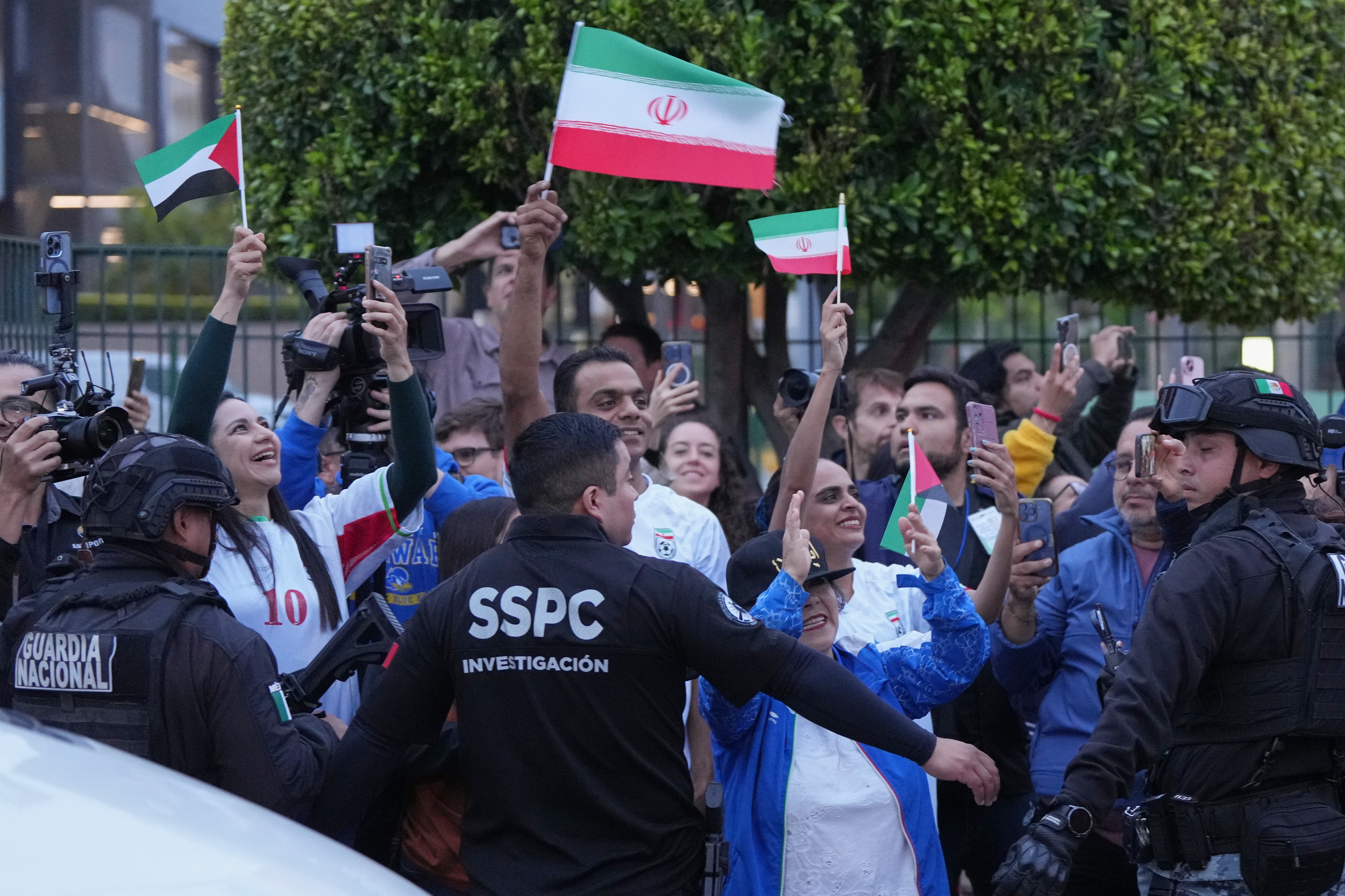 Iran fans wave as players arrive in Tijuana, Mexico, on Sunday, June 7, 2026