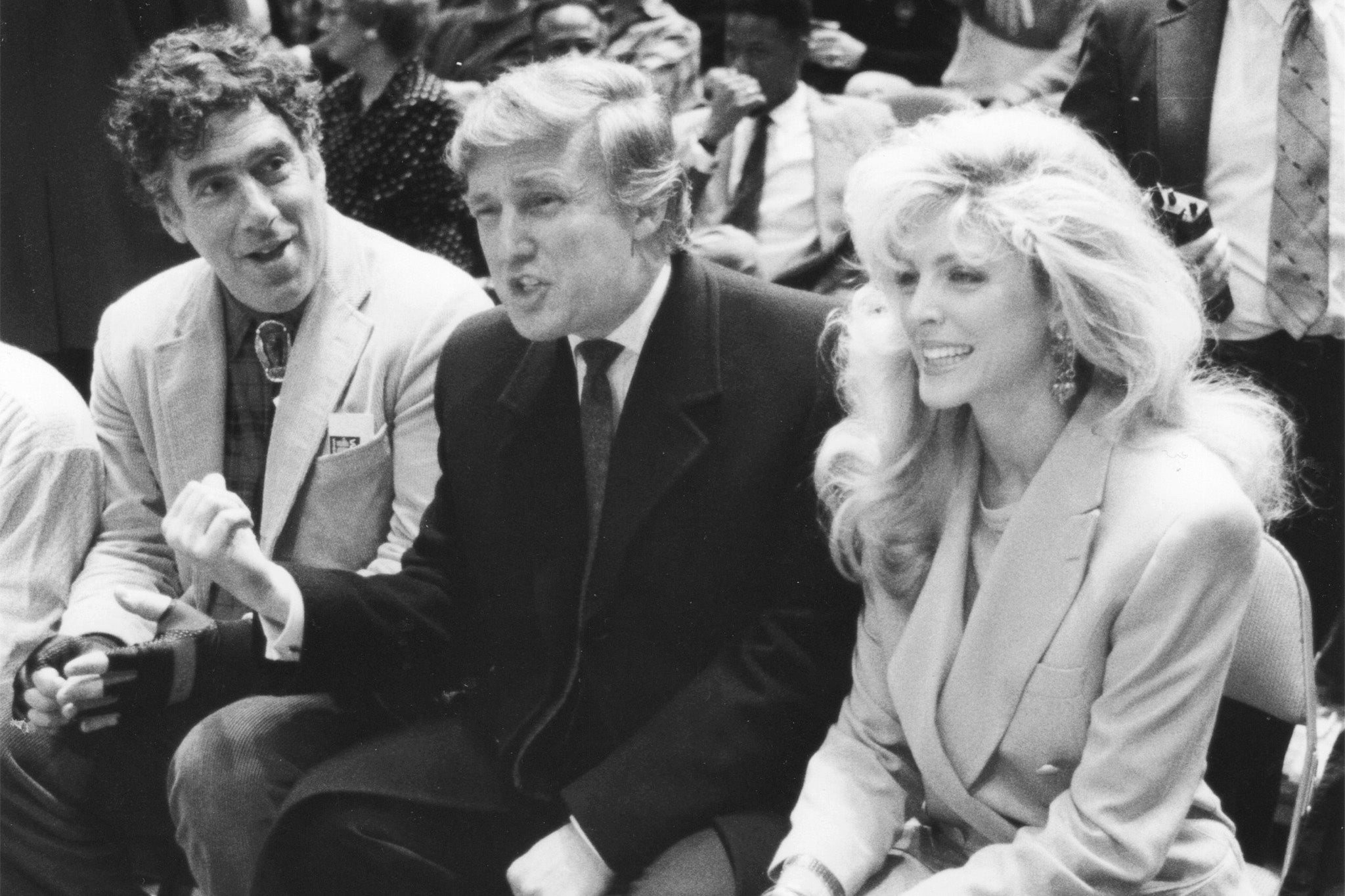 Trump, pictured courtside for Knicks game back in 1991 with his then future second wife Marla Maples and M*A*S*H star Eliot Gould, has attended Knicks games — but js he really a fan? (Newsday RM/Getty)
