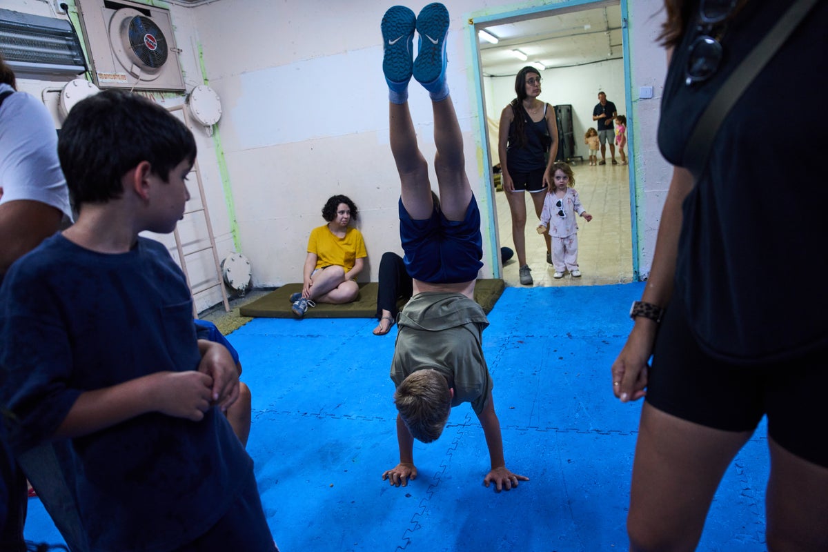 After morning of sirens, Israelis fall back into well-worn w