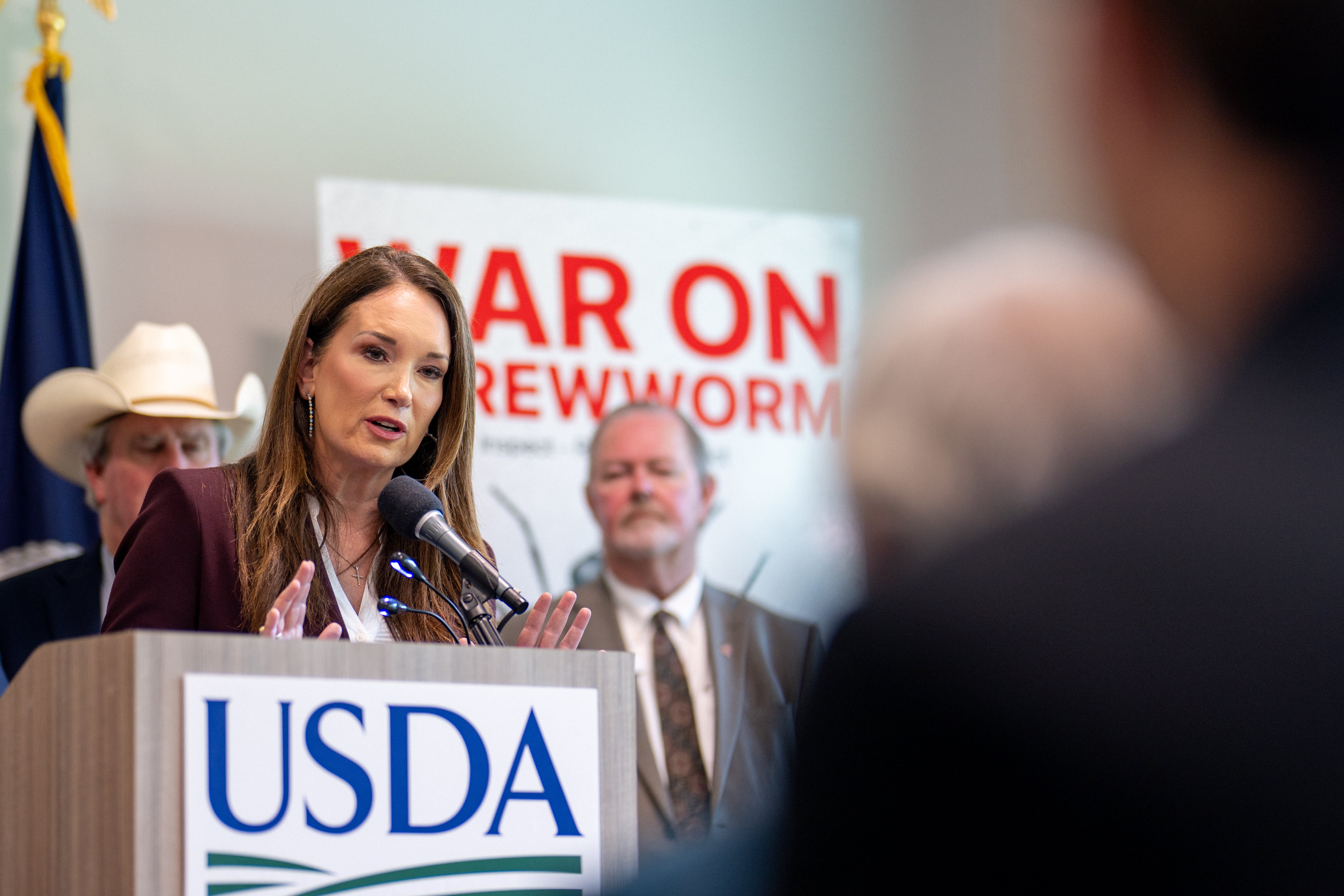 Agriculture Secretary Brooke Rollins speaks alongside Texas Governor Greg Abbott, ranchers, and health officials during a press conference concerning the New World Screwworm at the Knipling-Bushland US Livestock Insects Research Laboratory on June 08, 2026 in Kerrville, Texas (Getty)