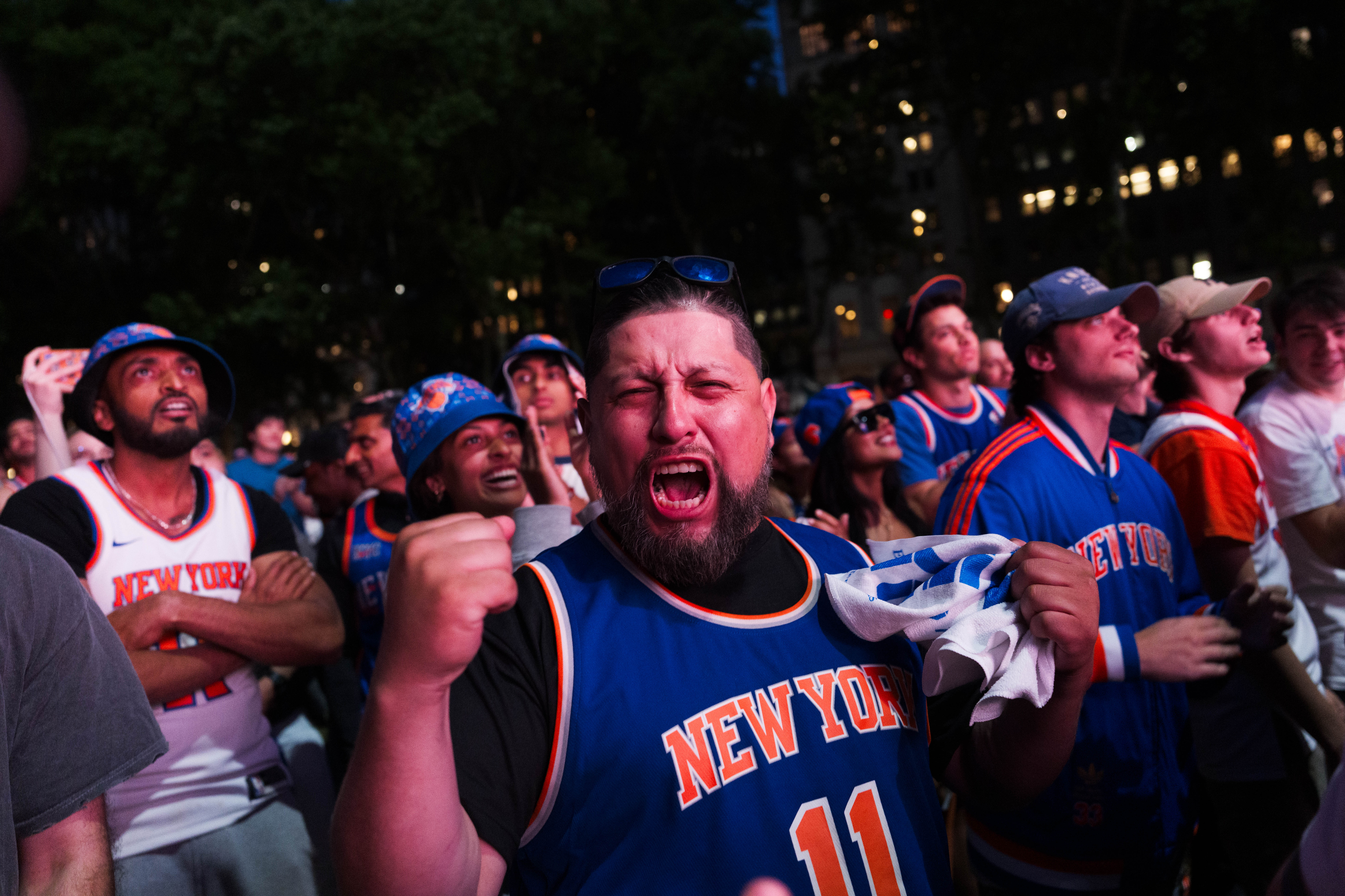 New York Knicks fans react during a watch party in Bryant Park for game 3 of the NBA finals (Getty)