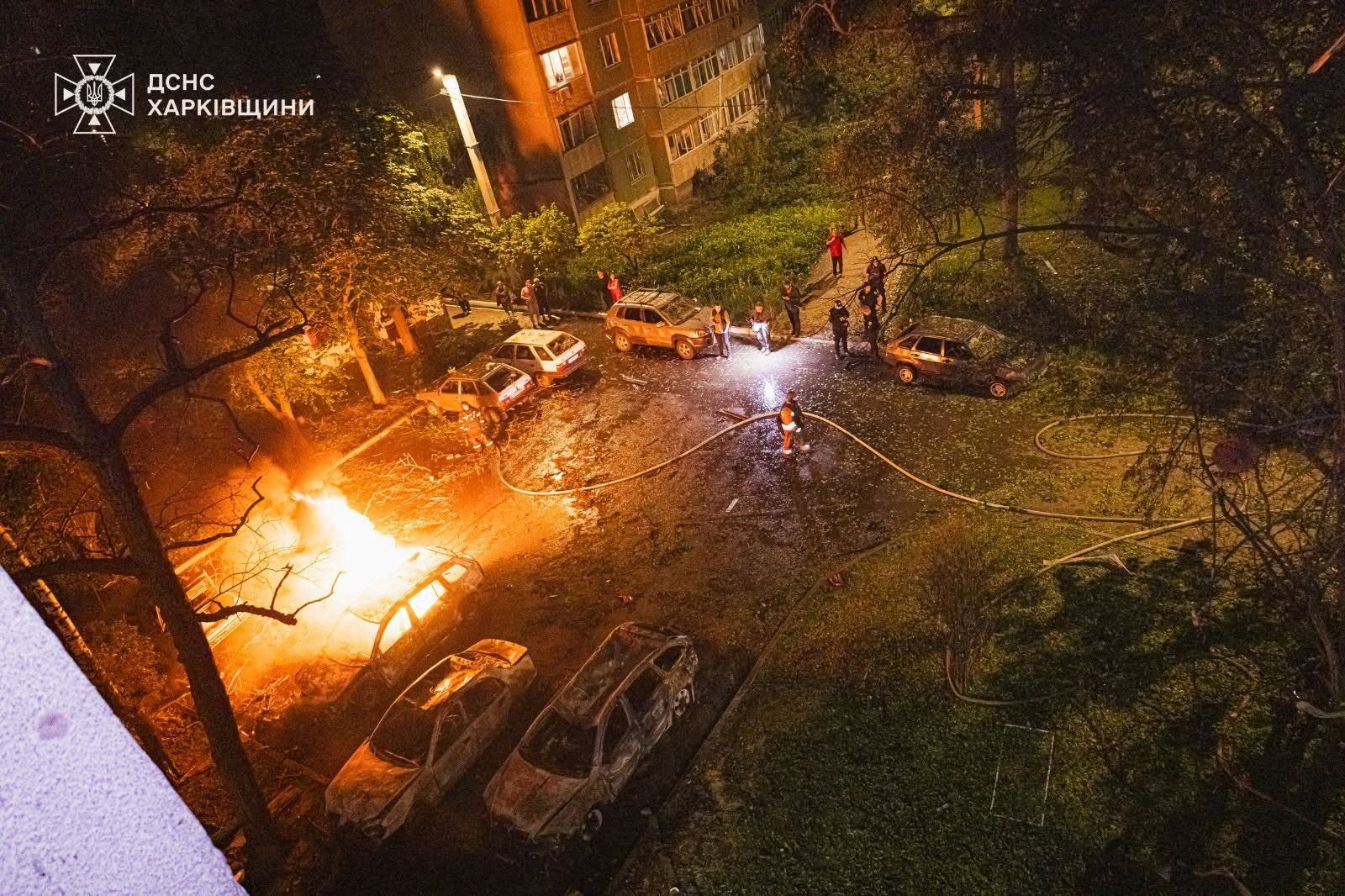 Firefighters work at the site of a residential area damaged during overnight Russian missile and drone strikes in Kharkiv (Reuters)