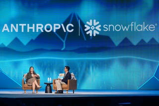 Anthropic co-founder and president Daniela Amodei speaks to Snowflake chief executive Sridhar Ramaswamy during the keynote presentation at Snowflake Summit 26 in San Francisco (Jeff Chiu/AP)