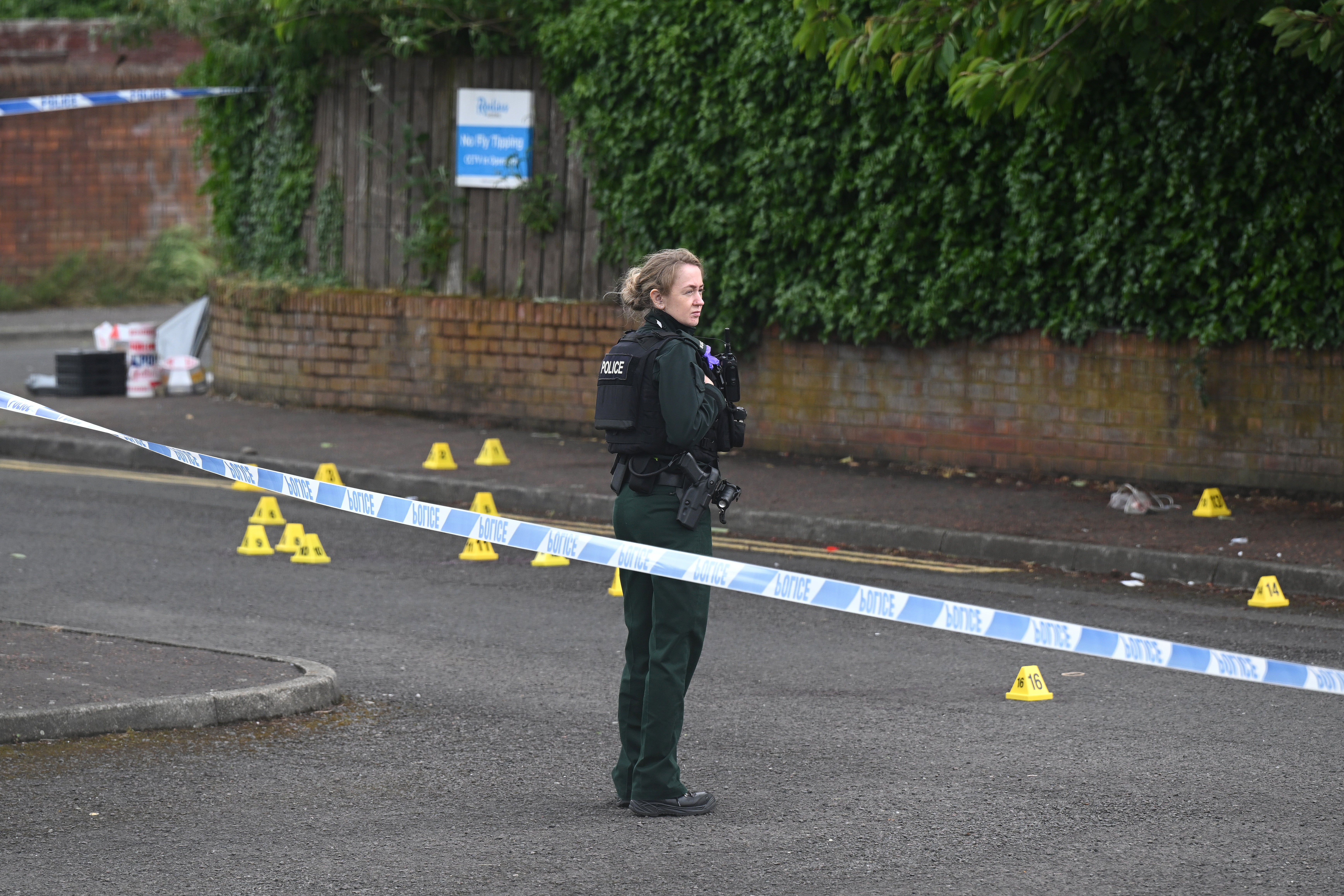 Police attend the scene following a stabbing attack in North Belfast