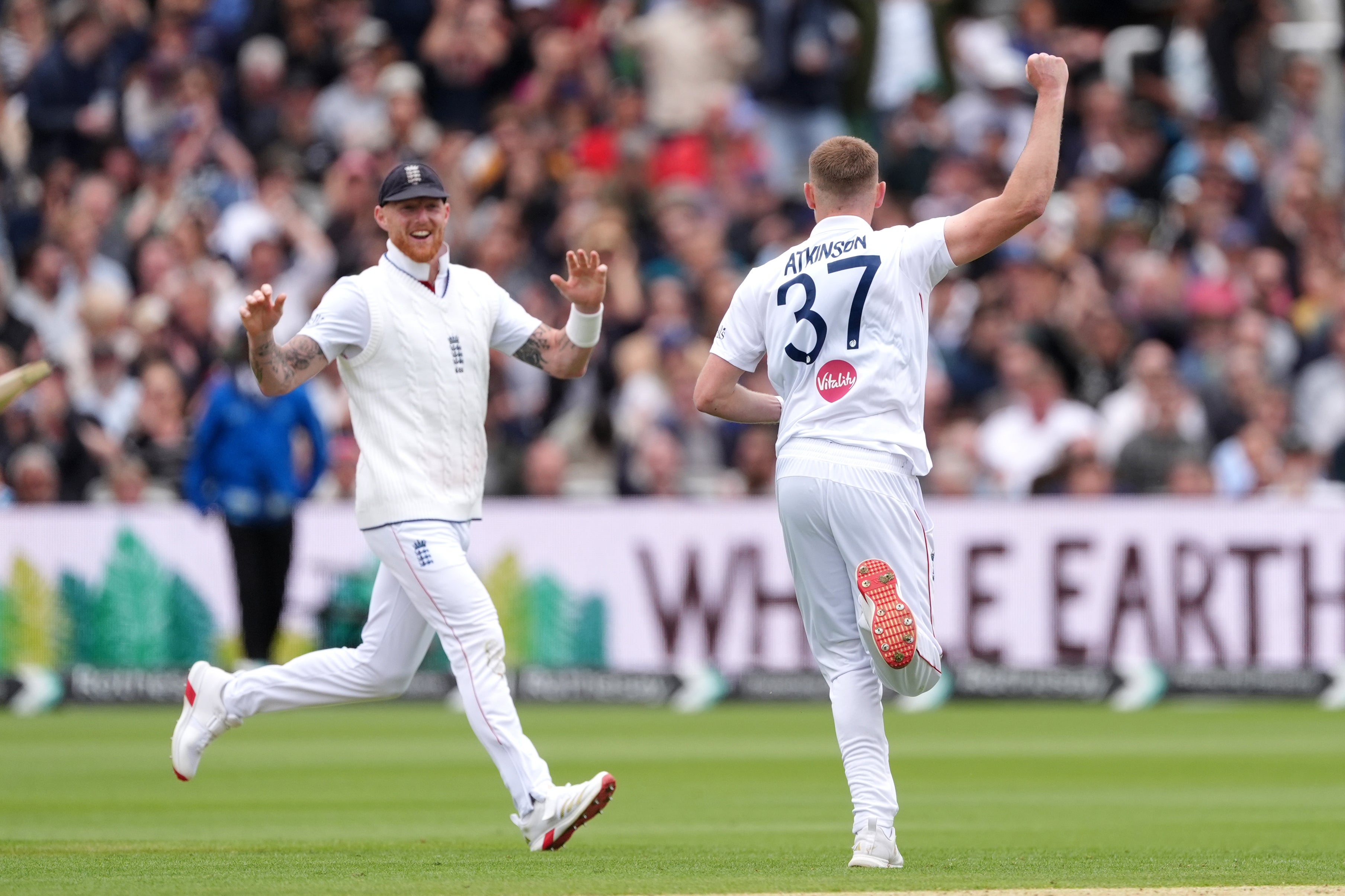 Gus Atkinson celebrates with Stokes after taking a wicket on Sunday (Ben Whitley/PA)