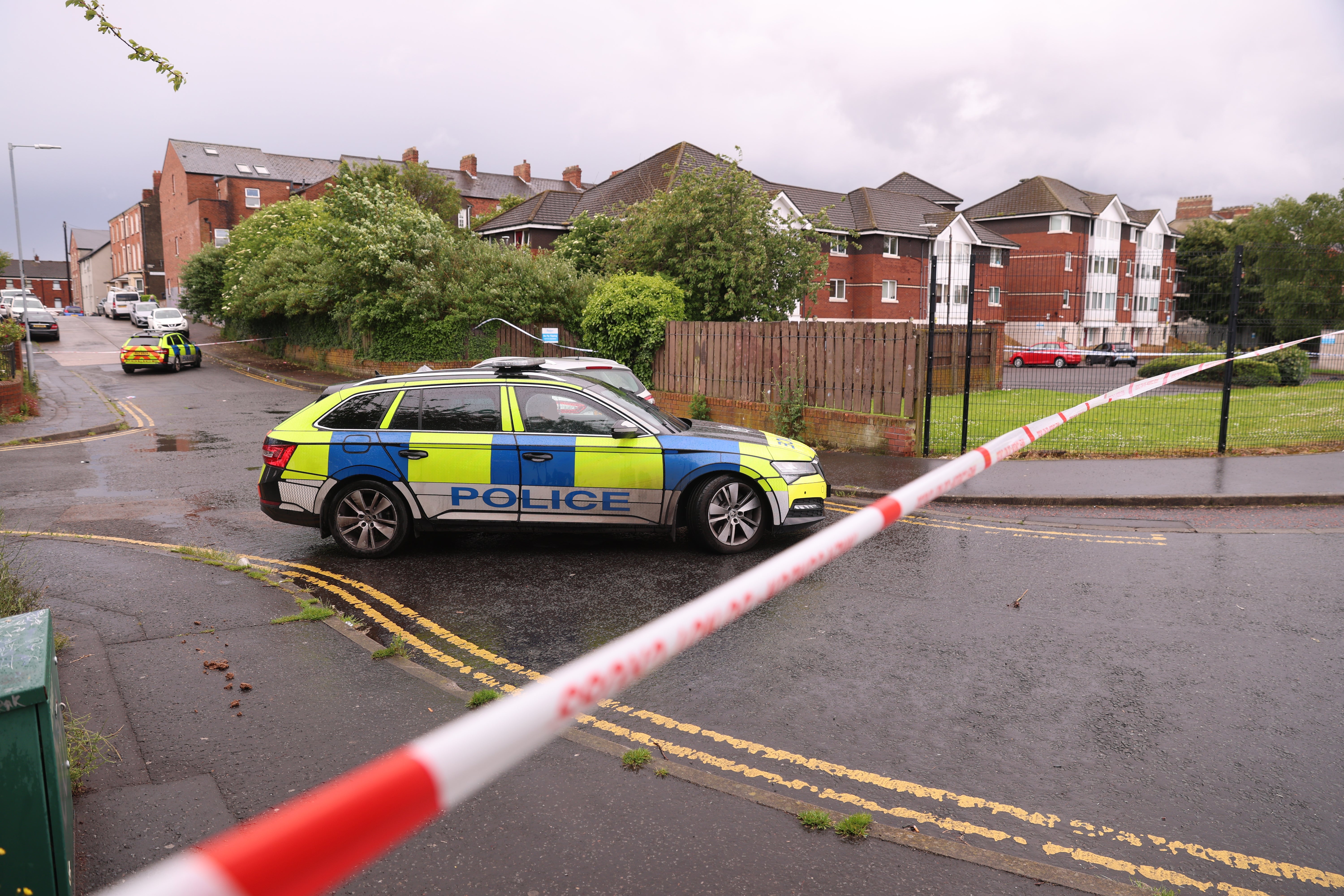 A police cordon at the scene of a stabbing outside apartments in the Kinnaird Avenue area of north Belfast