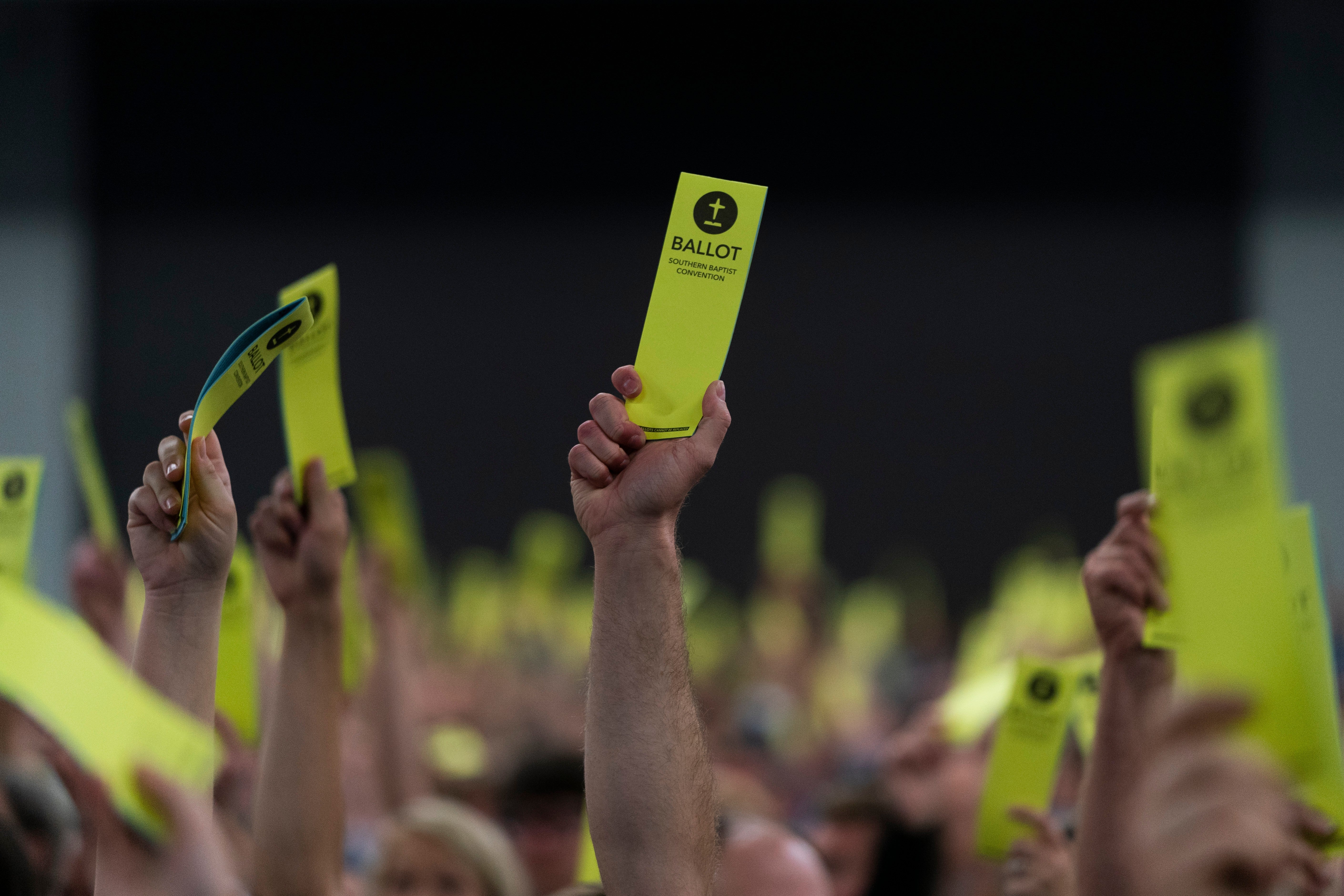 Attendees hold up their ballots during the Southern Baptist Convention's annual meeting in Anaheim in 2022