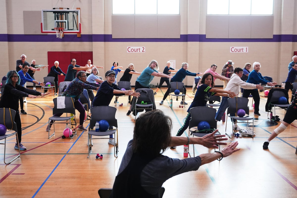 Playing hip-hop or Doris Day, older exercise instructors can