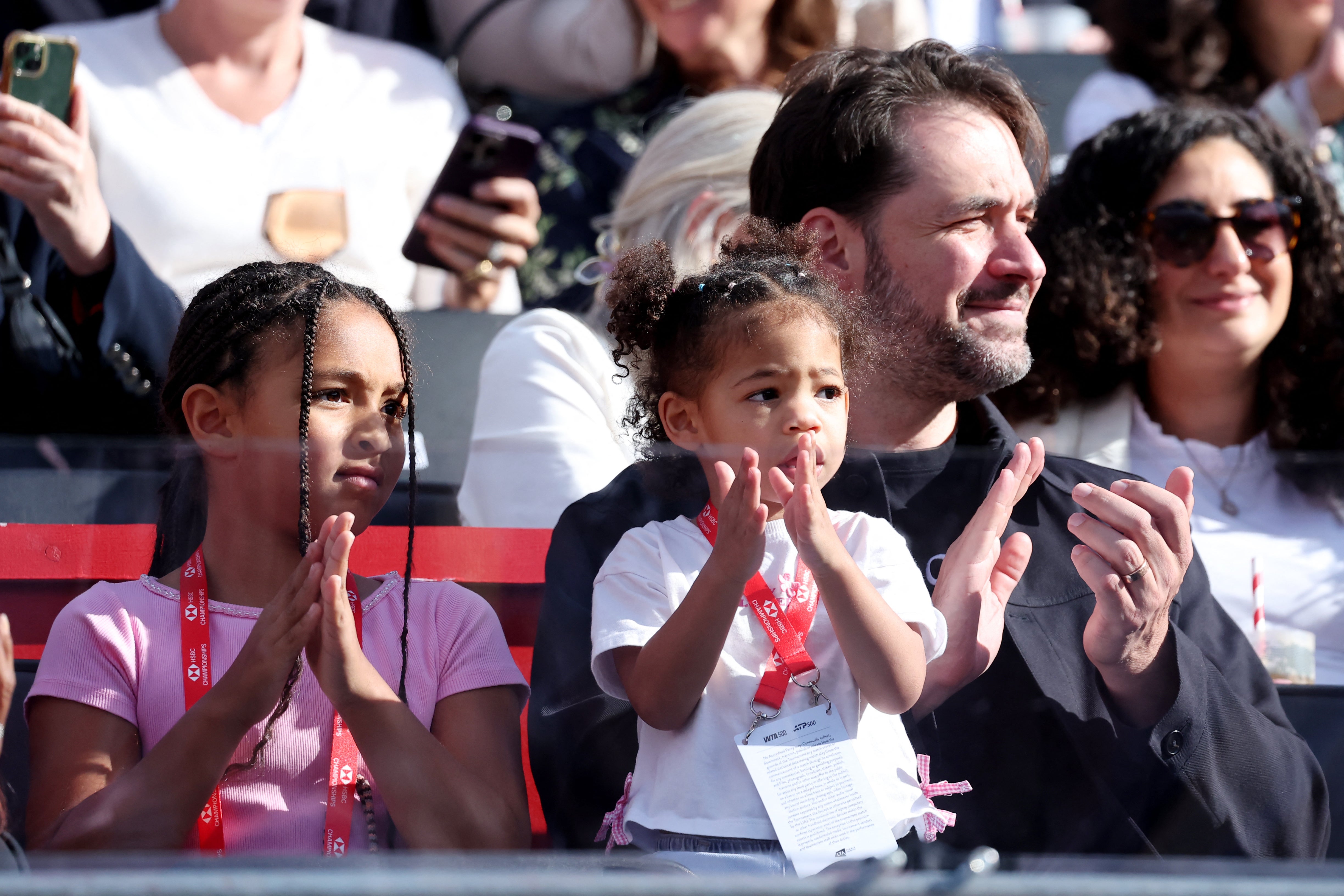 Alexis Ohanian, Olympia Ohanian and Adira River Ohanian, the husband and daughters of Serena Williams, watch on (Reuters)