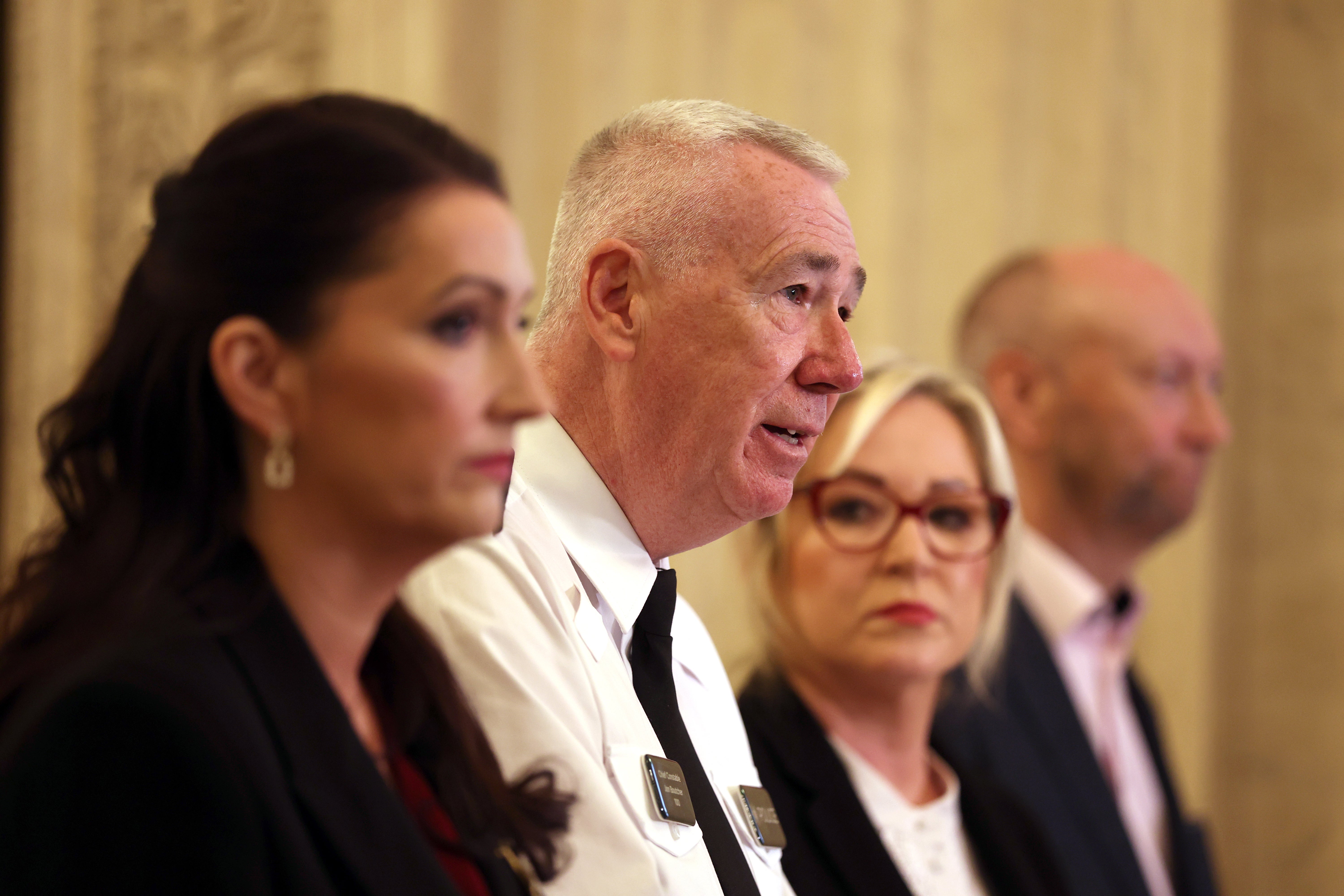 Deputy First Minister Emma Little-Pengelly, police chief Jon Boutcher, First Minister Michelle O’Neill and policing board chair Brendan Mullan speak to the media (Liam McBurney/PA) (PA Wire)