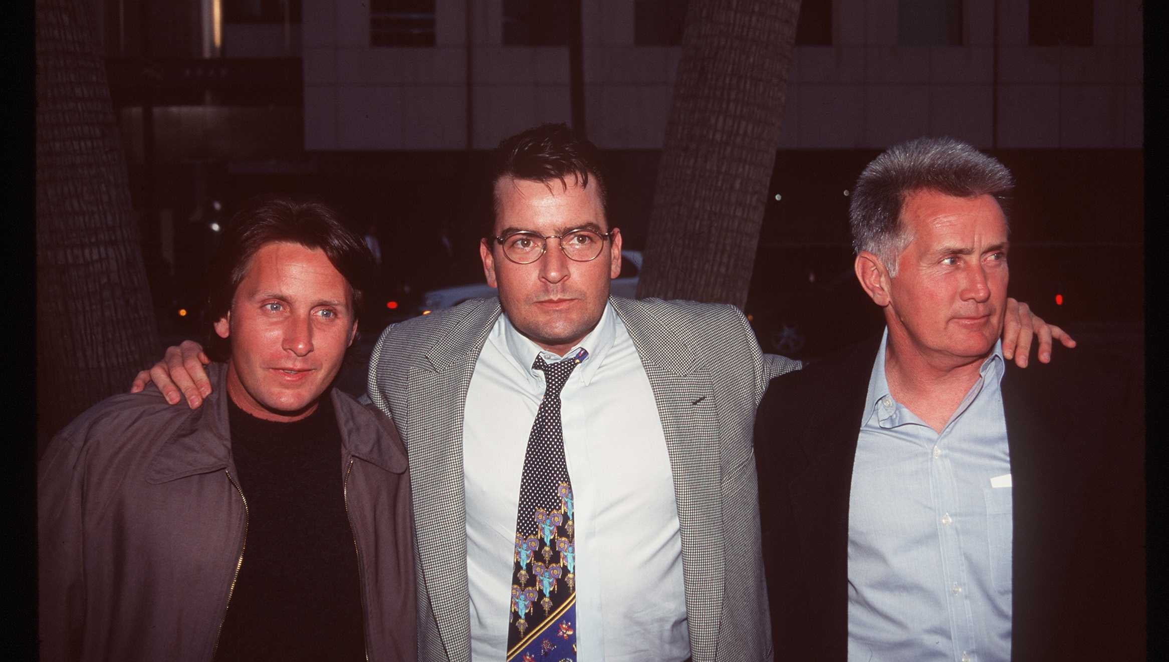 Emilio Estevez (left) and Martin Sheen (right) did not participate in Charlie Sheen's (center) documentary (Getty)