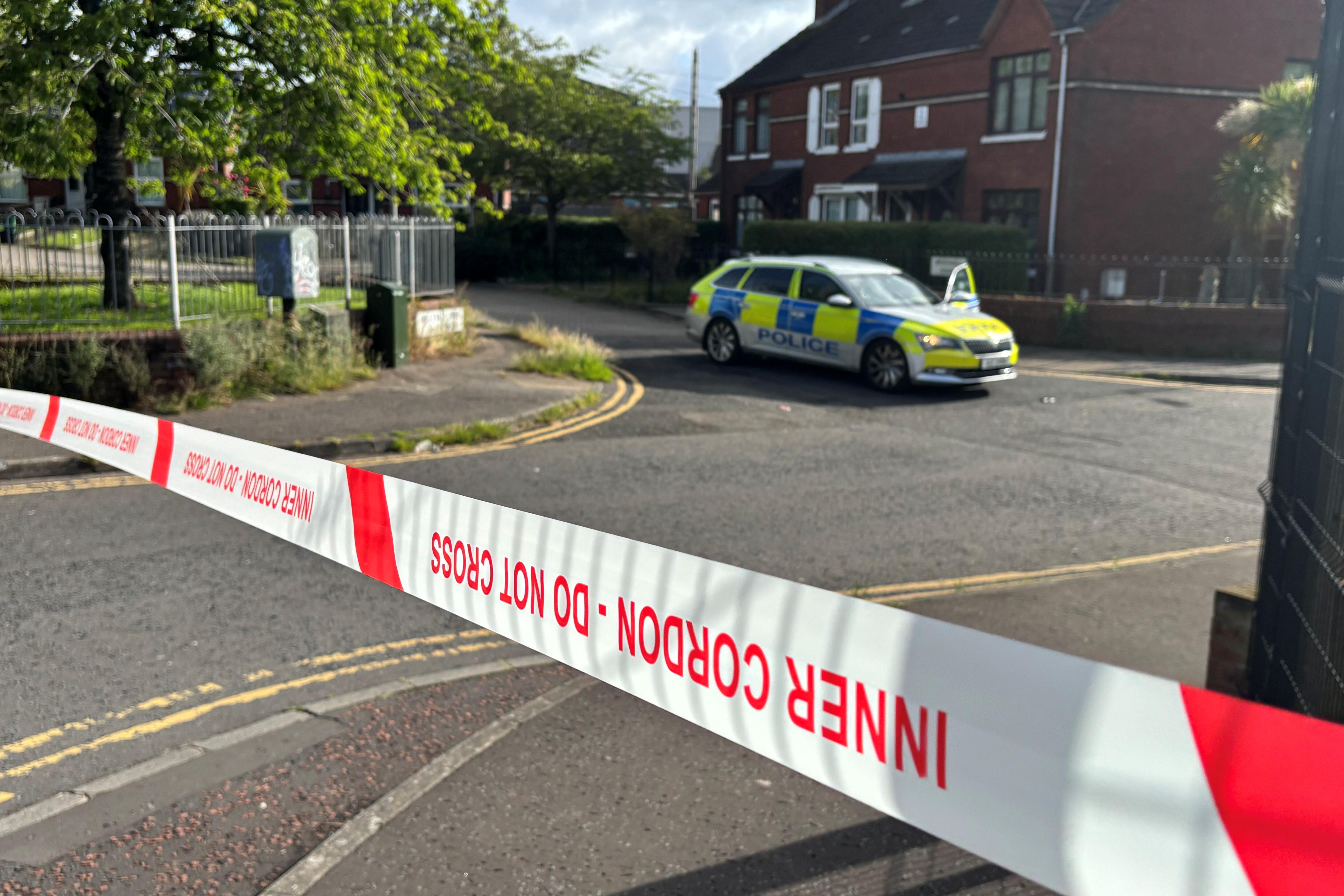 A police cordon at the scene of a stabbing outside apartments in the Kinnaird Avenue area of north Belfast (PA Wire)
