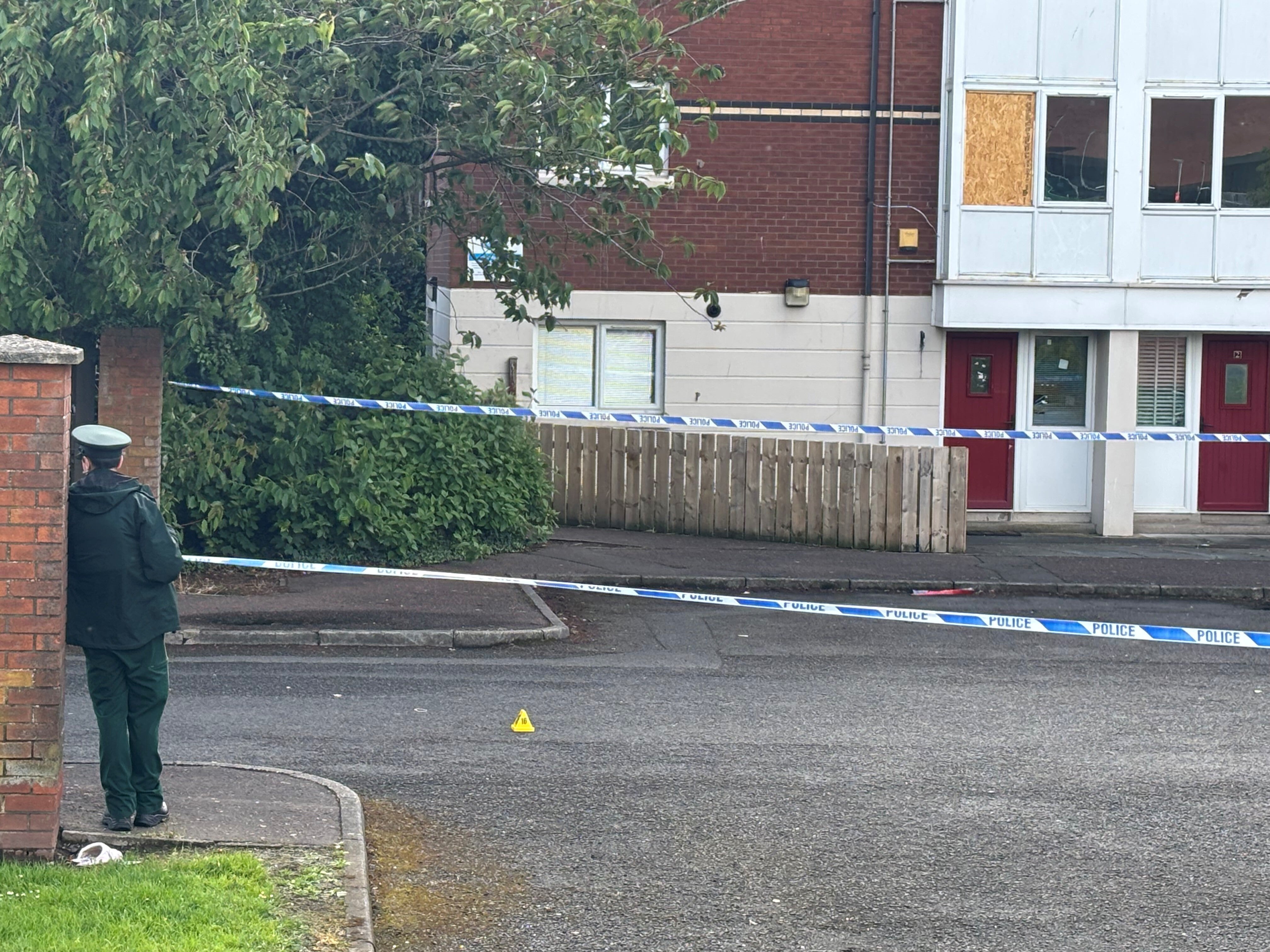 A police cordon at the scene of the attack outside apartments in the Kinnaird Avenue area of North Belfast (Rebecca Black/PA) (PA Wire)