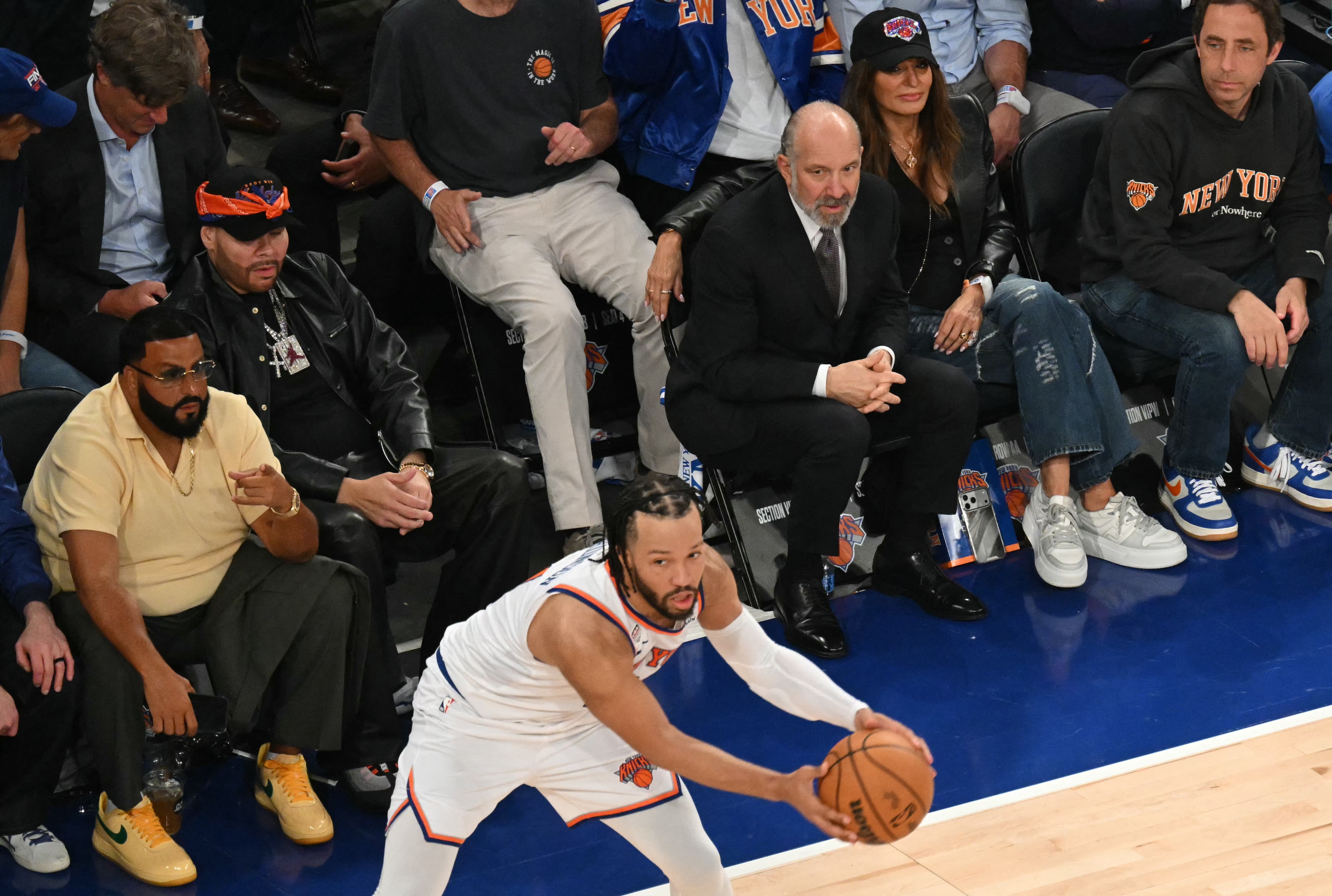 Commerce Secretary Howard Lutnick sitting courtside (AFP via Getty Images)