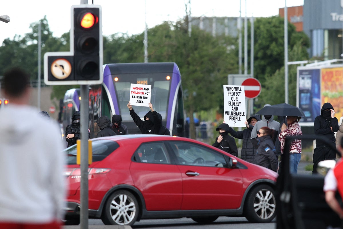 Belfast stabbing latest: Fires started as proteste
