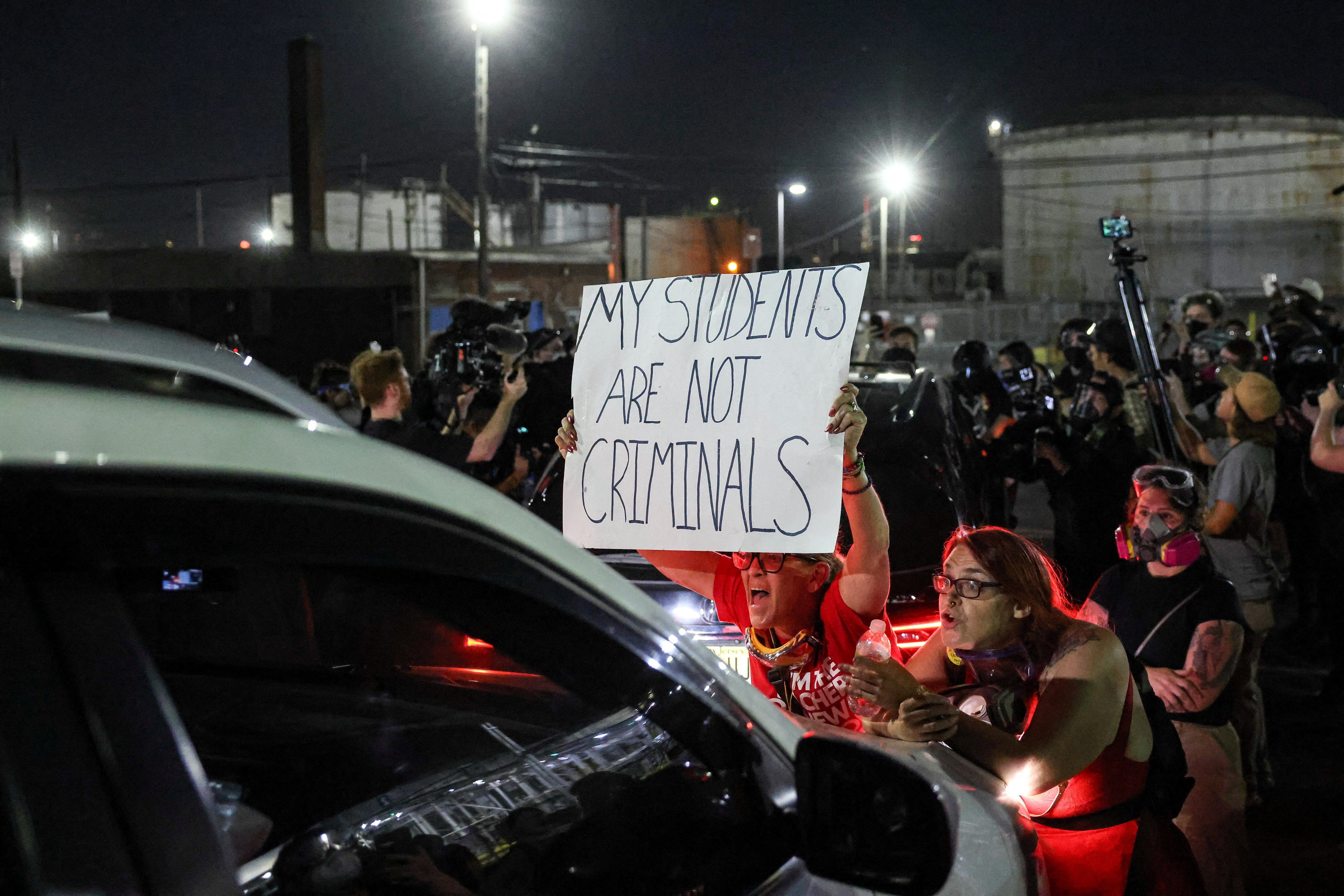 Tensions outside Delaney Hall have boiled over into violence with ICE agents in military gear beat back protesters who have remained outside the jail for weeks (Reuters)
