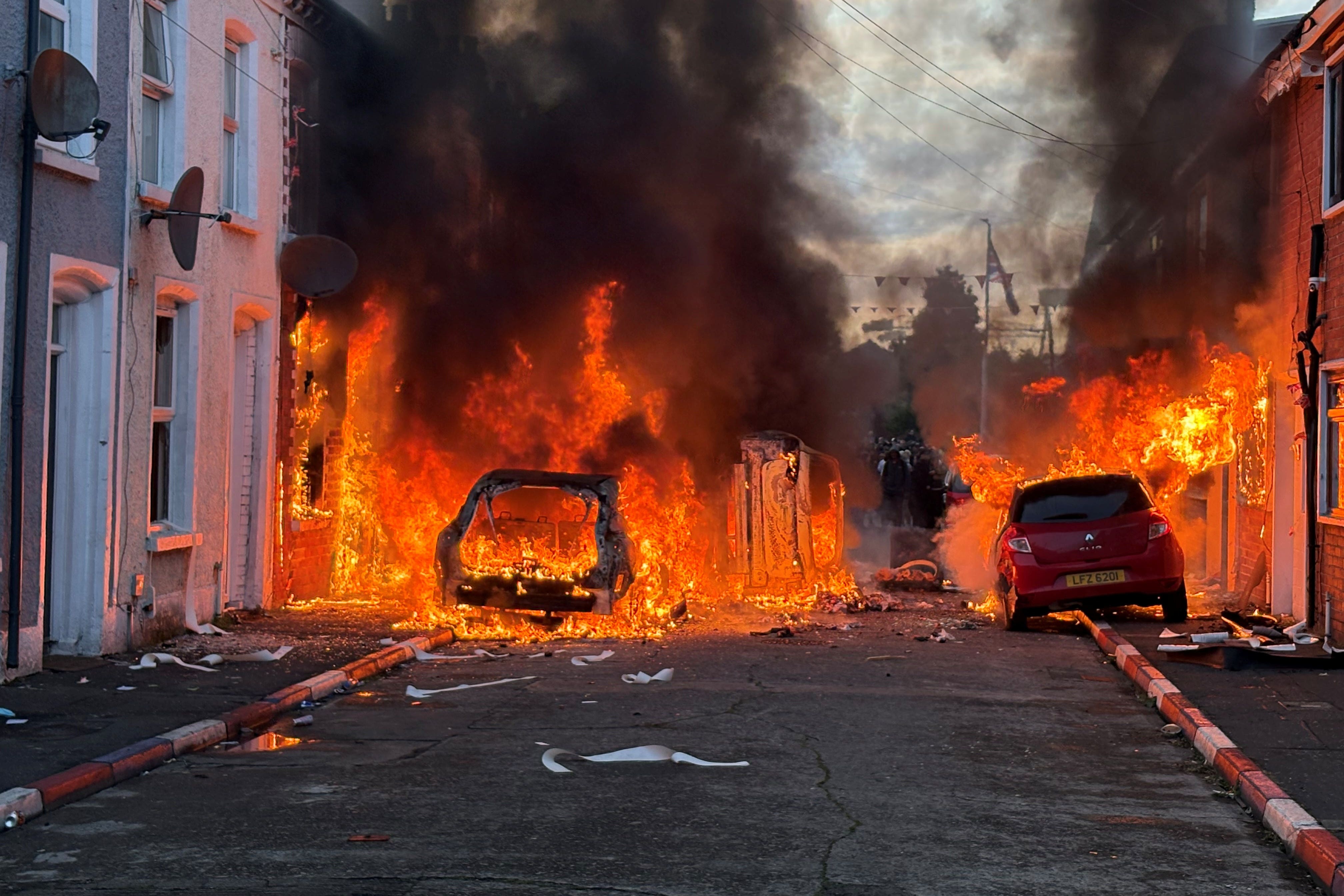 Vehicles were set on fire by protesters on Lendrick Street in Belfast (PA Wire)