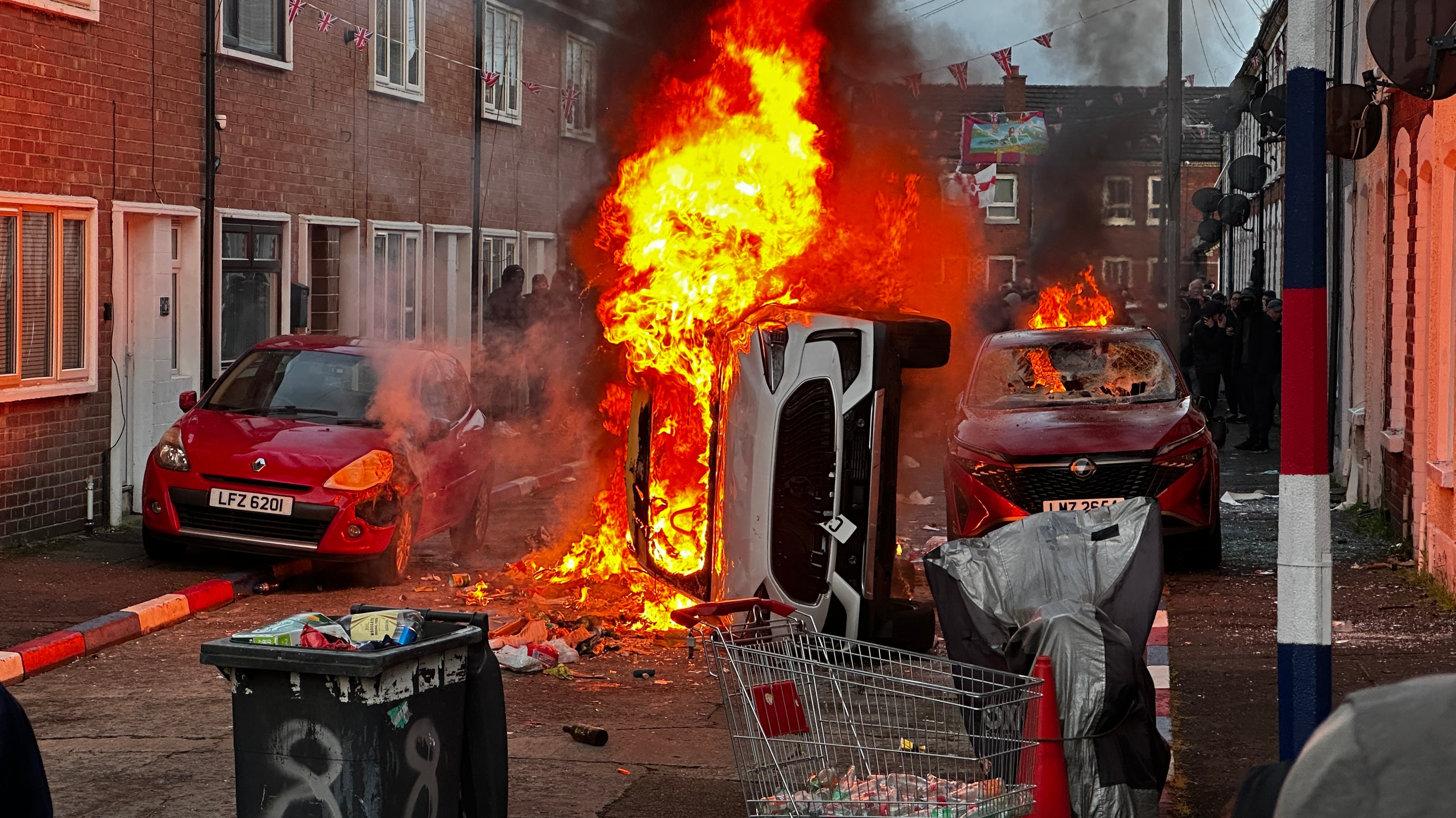 Vehicles set on fire by protesters on Lendrick Street