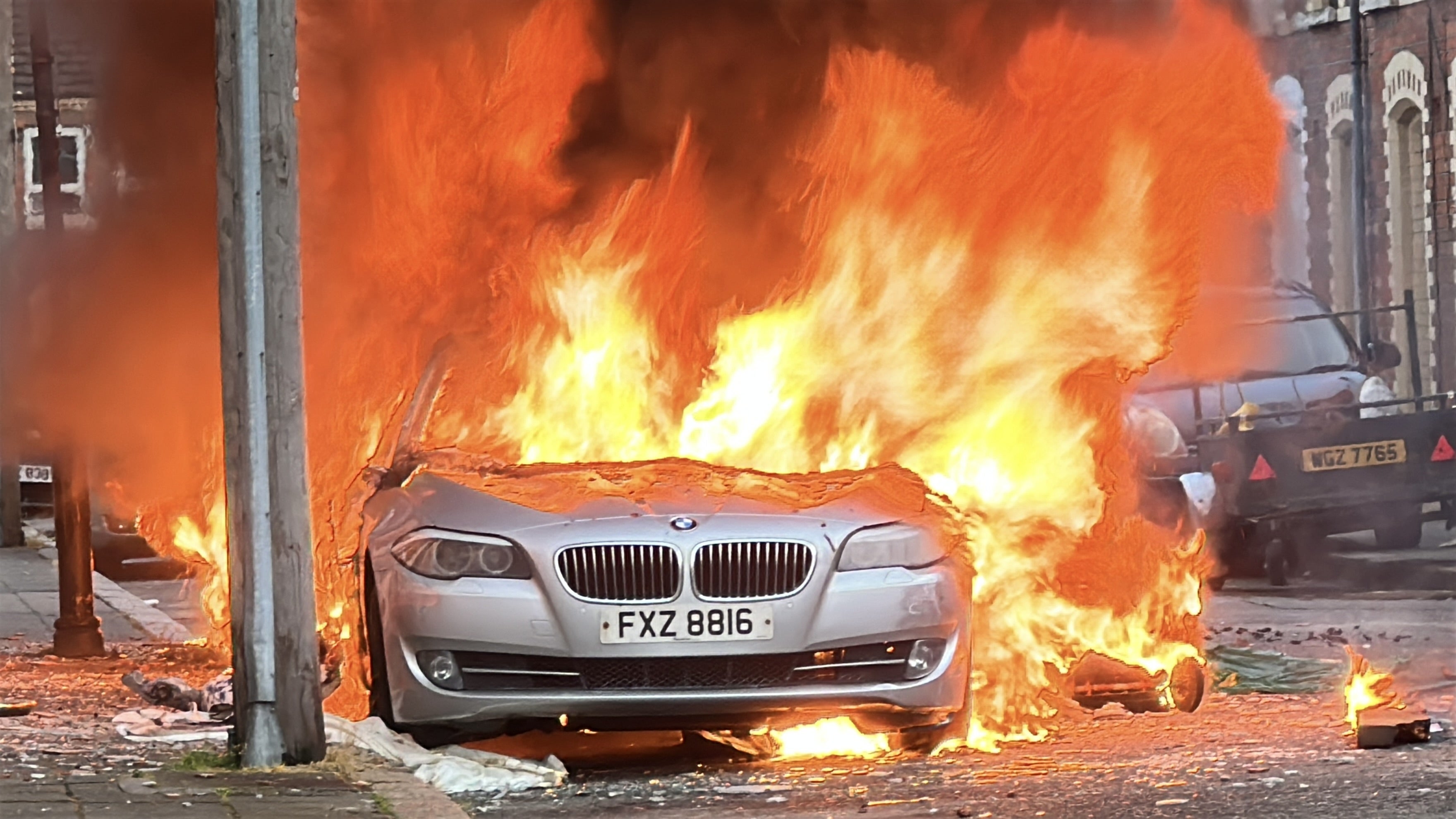 A car set on fire by protesters in east Belfast on Tuesday (PA)