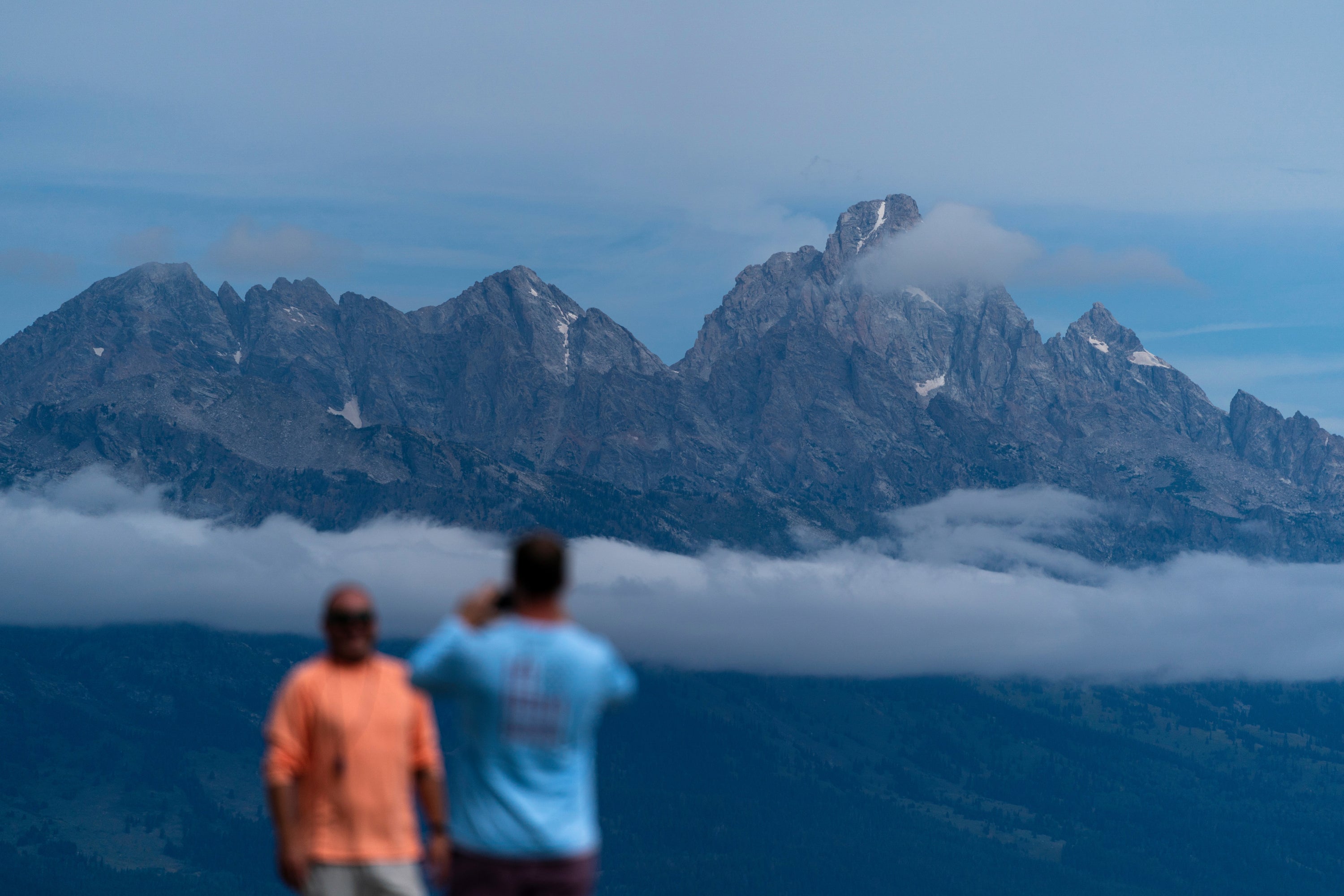 Tourists take photos in Grand Teton National Park in Wyoming