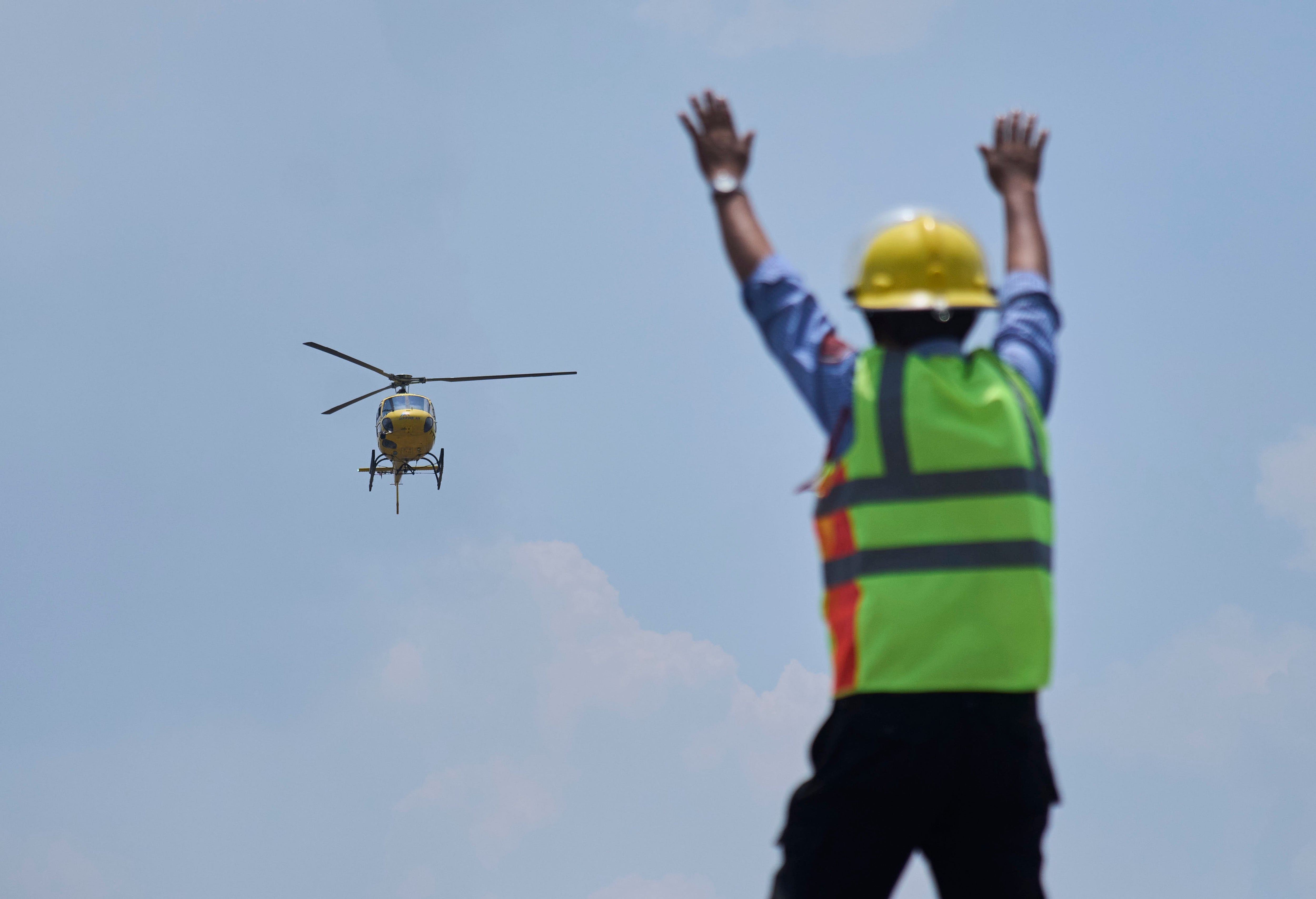 A helicopter carrying Dawa Sherpa arrives at HAMS Hospital in Kathmandu, Nepal, on Thursday (AP)