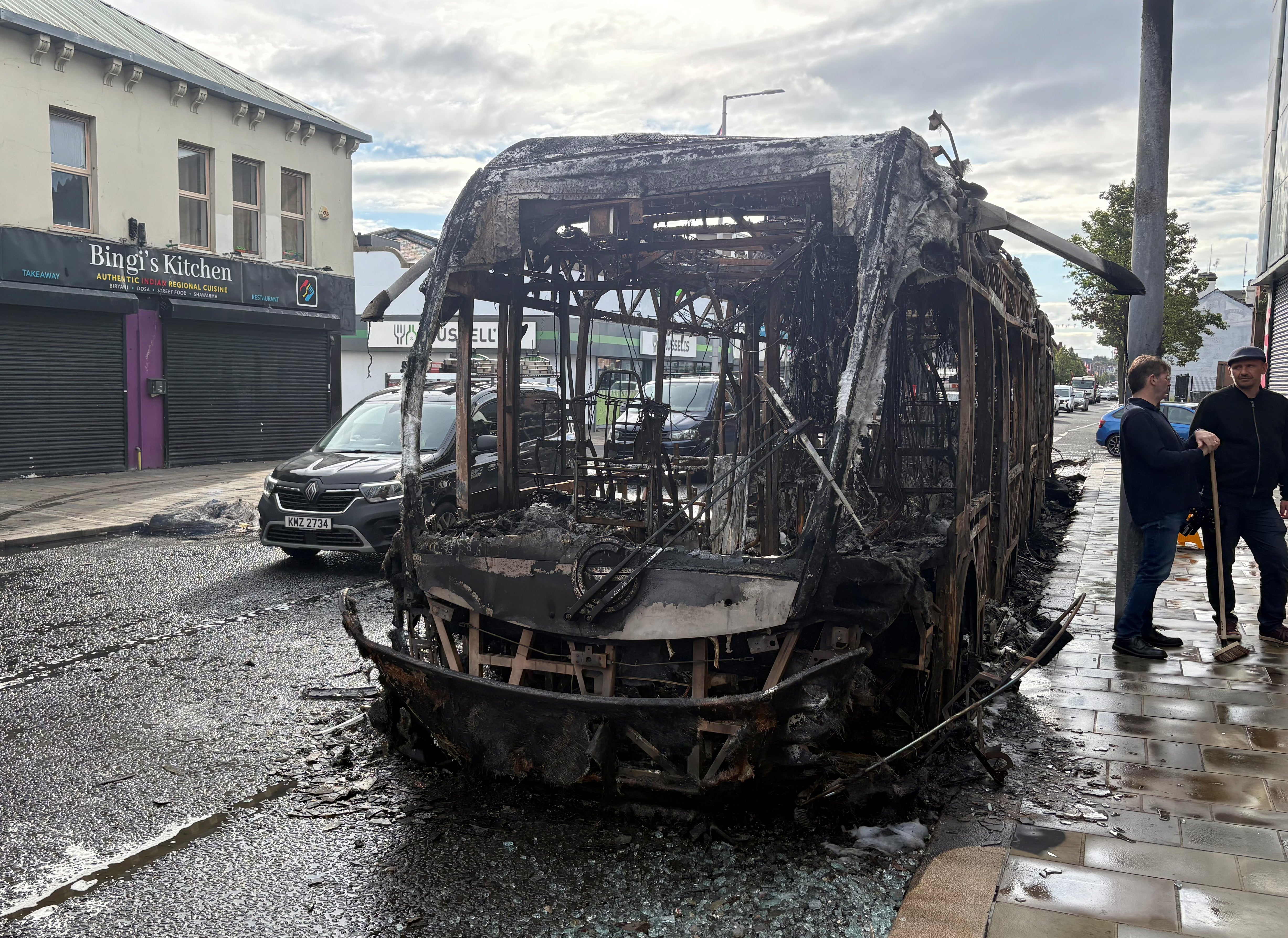The wreckage of a Glider bus which was torched on Newtownards Road in east Belfast (PA) (PA Wire)